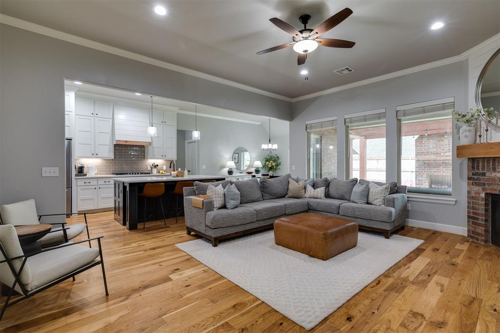 Welcome to life at The Grove, one of Edmond's most sought-after communities where thoughtfully designed amenities and beautiful surroundings create a place you'll love coming home to. Built in 2019, this beautifully maintained home offers the perfect balance of modern comfort, functional living, and inviting spaces designed for everyday life.Inside, you'll find an open-concept layout filled with natural light, soaring ceilings, and seamless flow between the living, dining, and kitchen areas. The spacious kitchen features updated appliances, a large island with seating, a generous pantry, and plenty of room to gather with family and friends. In addition to five bedrooms and three full bathrooms, the fifth bedroom provides endless possibilities as a media room, playroom, home office, or even a gameroom to fit your changing needs.Step outside to an expansive covered patio designed for year-round enjoyment, complete with an outdoor fireplace and a dedicated space to mount a television for entertaining. The spacious backyard offers plenty of room to relax, host guests, or simply enjoy the outdoors.As a resident of The Grove, you'll have access to an impressive collection of community amenities, including neighborhood pools, greenbelt walking trails, multiple playgrounds, and additional recreational spaces that make it easy to enjoy everything the neighborhood has to offer.If you've been searching for a home that combines flexible living spaces, modern finishes, and an exceptional Edmond location, this one is ready to welcome you home.