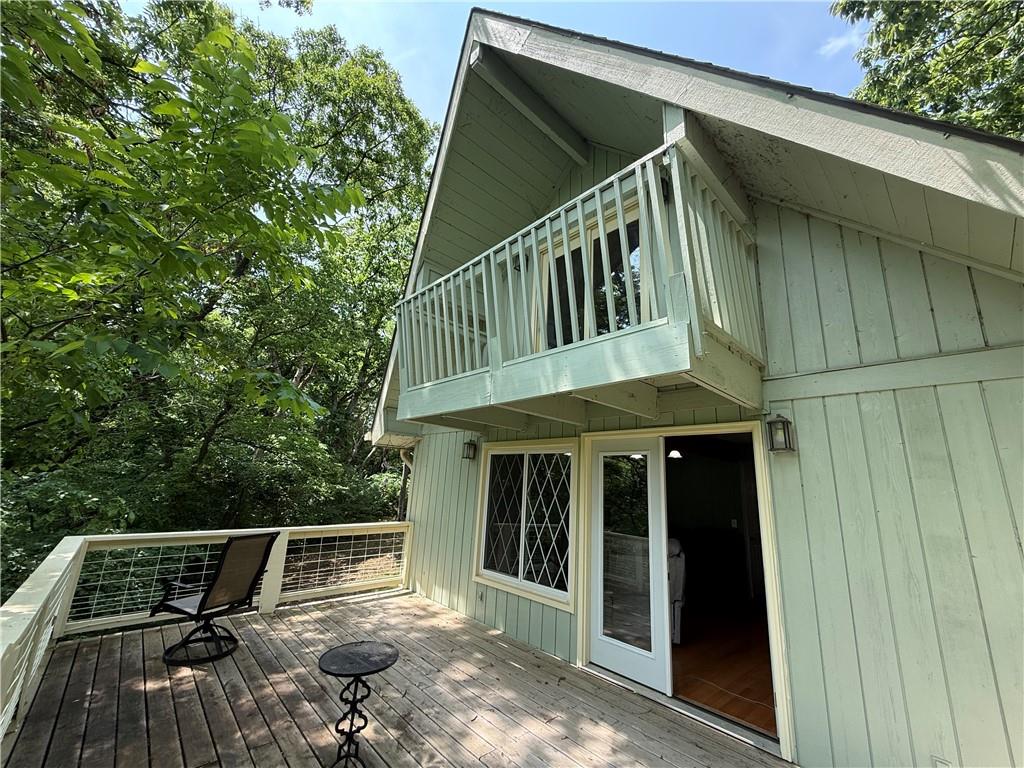 Escape to your lakeside retreat! This 4-bedroom, 3-bathroom home is nestled among mature trees in peaceful Lakewood Hills. Enjoy cozy nights by one of two fireplaces, then welcome spring mornings out on the deck. An oversized detached 2-car garage gives you plenty of storage. Community perks include access to a clubhouse, pool, and play area—perfect for relaxing or entertaining year-round.