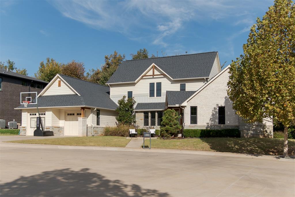 Nestled in one of Edmond’s most sought-after neighborhoods, this stunning 2,880 sq ft modern craftsman offers the perfect blend of style, comfort, and location. Tucked away in a quiet cul-de-sac and backing up to walking trails and a peaceful park, this home provides both privacy and convenience — just minutes from shopping, dining, and downtown Edmond.
Step inside to find a bright, open floor plan filled with natural light from expansive windows and accented by soaring wood beams and a striking wood-burning fireplace. White oak wood flooring throughout living room and kitchen. The chef’s kitchen is designed for entertaining, featuring a 6-burner Monogram range, sub zero refrigerator, oversized island, and beautiful views of the wooded creek behind the home.
The spacious primary suite is a true retreat with a spa-like soaking tub, dual vanities, and an impressive walk-in closet. Upstairs, you’ll find two generously sized bedrooms, each with its own private bath, plus a secured storage room. A large walkout attic offers potential for a second living area, home office, or additional bedroom. Tankless hot water heater.
Enjoy outdoor living year-round on the expansive back patio complete with a cozy fireplace — perfect for relaxing or hosting friends.
Located in the heart of Edmond, this home combines natural beauty, craftsmanship, and convenience in an unbeatable setting. New carpet being installed in primary suite Nov 21st!