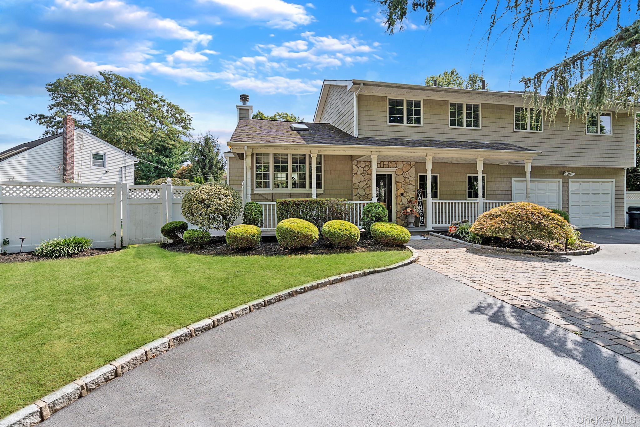 Stunning Melville Home: "Built for Comfort" Welcome to this exceptional 4-bedroom, 2.5-bathroom residence located in the highly sought-after Half Hollow Hills School District, where comfort meets luxury in every detail. Step inside and you will find the Inviting High-Ceiling Dining Room with floor to ceiling natural stone wood burning fireplace. Experience the elegance that is enhanced with multiple skylights, a beautiful bay window and sliders to a Sunroom that fills the home with natural light. Entertain while cooking in style with granite counter tops, a Viking oven, Kitchen Aid refrigerator and dishwasher, beautiful cabinetry with lights, a deep sink, and radiant heated floors for those chilly mornings or just spread out and Relax in your extra-large den/family room. Escape to your Luxurious Primary Suite Retreat featuring professional grade high ceiling lighting with a gorgeous fireplace and direct access to a spa-like master bathroom equipped with skylight, relaxing jacuzzi tub and luxurious modern shower. The updated hot water heating system ensures a soothing experience year-round. Make memories in your Outdoor Oasis with this beautifully landscaped property designed for relaxation and entertainment, featuring outdoor LED in-ground lighting (controlled by automatic timer), an electronically controlled retractable Awning and impressive 20,000-gallon in-ground pool (18' x 36') with waterfall, multiple jets, multi-colored lights, spa heater and diving board. The yard boasts fresh natural sod/grass and a brand new shed. The U-shaped driveway accommodates 3-5 vehicles comfortably making it perfect for hosting family and friends. The house is equipped with indoor and outdoor LED ceiling lighting and Slomin's professionally installed video equipment with a built-in central vacuum system for convenience. The property features a commercial-grade central air conditioning system that provides powerful cooling throughout the home. Additional highlights include new washer/dryer, high electrical outlets in every room for easy access to electronics as well as other options including low dim lighting that provide a unique ambiance. This remarkable home offers the ultimate blend of comfort, luxury and modern technology perfectly located in a beautiful residential neighborhood, just steps away from top-rated schools and amenities. Don't miss the chance to make this dream home your own!