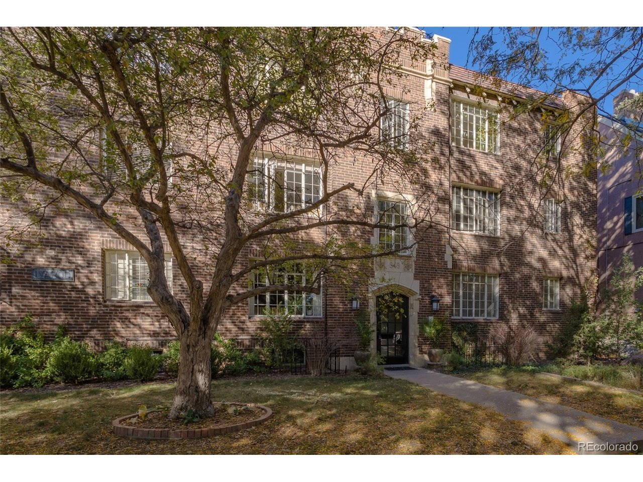 Historic Capitol Hill charm meets everyday convenience! Located in a classic 1929 brick building, this light-filled, ground-floor end-unit condo offers 950 square feet of comfortable living space, two bedrooms, and a standout combination of urban conveniences, including deeded garage parking and in-unit laundry.Original hardwood floors bring warmth and character to the spacious living room, while the separate dining room offers flexibility for entertaining, everyday dining, or a home workspace. The kitchen features granite countertops, terrazzo tile flooring, and a gas range. Both bedrooms feature hardwood floors and ceiling fans, while the updated bathroom showcases custom tilework. Fresh interior paint and an updated electrical panel add to the home's appeal.Outside, enjoy the building's shared garden courtyard with a gas grill, an inviting retreat in the heart of the city. Just beyond your doorstep, discover the restaurants, coffee shops, grocery stores, and neighborhood amenities that make Capitol Hill such a vibrant place to live. Cheesman Park and public transit are also conveniently nearby.With timeless architectural character, a versatile floor plan, and practical amenities that make urban living easier, this move-in-ready condo offers an inviting opportunity to enjoy Denver's historic Capitol Hill neighborhood.Qualified buyers may be eligible for a lender credit of up to 1% of the loan amount toward closing costs or an interest rate buydown. Contact the listing brokerage for details.