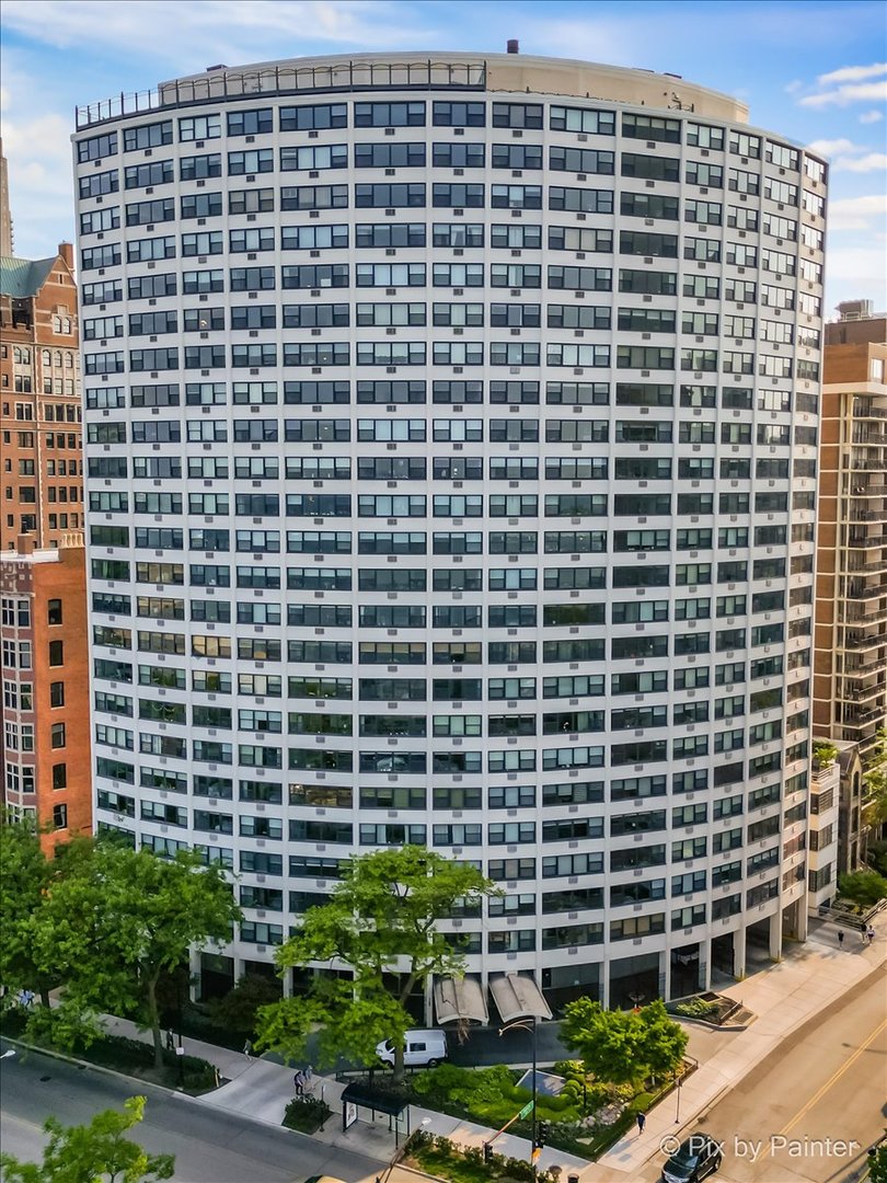 Rarely available "A" tier unit on the 19th floor with panoramic views of Lake Michigan, Oak Street Beach, and the city skyline! This beautifully updated 2-bedroom, 2-bath condo is a front-to-back end unit in an iconic mid-century modern curved building in the heart of the Gold Coast. From the moment you enter, you'll be surrounded by natural light and sweeping sunrise-to-sunset vistas, as the unit spans from the back of the building to the front.    The open-concept kitchen has been fully renovated with a striking waterfall island and high-end built-in Thermador appliances, creating a perfect space for both everyday living and entertaining. The expansive living and dining area features oversized windows that frame weekly Navy Pier fireworks during the summer months-enjoy the show right from your living room or while relaxing on the rooftop deck.    Additional upgrades include new Friedrich in-wall AC units, updated bathrooms (one with a soaking tub, one with a walk-in shower), new in-ceiling lighting with dimmers, an Electrolux in-unit washer and dryer, hardwood flooring throughout, and a water filtration system. The spacious primary suite offers generous closet space, while the second bedroom works beautifully as a guest room or office.    The seller is open to selling the unit fully furnished, making this an ideal turnkey option for a full-time residence or the perfect in-town home. The custom TV wall unit and all furnishings are negotiable.    This full-amenity, pet-friendly building offers 24-hour door staff, a rooftop deck with incredible lake views, fitness center, renovated elevators (plus a separate freight elevator), party/work room, bike storage, package room attendant, and dry cleaning pickup/drop-off. Residents also enjoy valet parking with a dedicated wash station-garage attendants will wash your car on request. On-site management, maintenance, and engineer support provide added convenience. HOA includes electric, water, basic cable, and Wi-Fi.    Unbeatable location at Division and Lake Shore Drive, directly across from Oak Street Beach and the lakefront path. Stroll to Lincoln Park, the Zoo, Magnificent Mile shopping, Gold Coast dining, the Division Street Farmer's Market, and Navy Pier fireworks. This is Chicago living at its finest-schedule your private showing today!