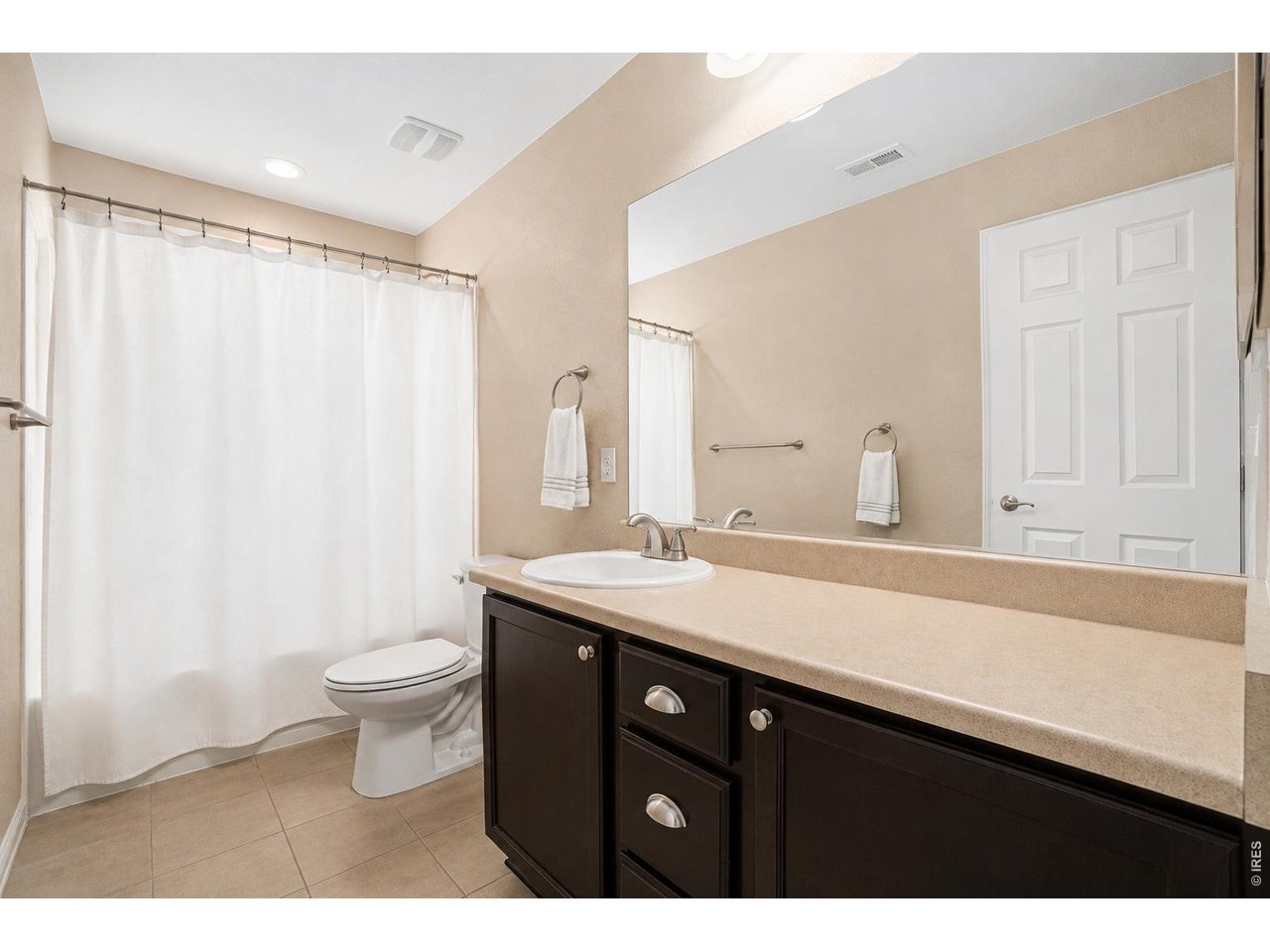 If you've been searching for space, this home delivers in every way! With more than 6,000 square feet, 7 bedrooms, 6 bathrooms, and four separate living areas, it's a rare opportunity to own a home of this size in one of Northern Colorado's most sought-after communities, Water Valley. Designed for both everyday living and entertaining, you'll find spacious rooms throughout, luxury vinyl plank flooring, upgraded tile finishes, and a flexible floor plan that easily accommodates large families, multi-generational living, guests, or those who simply want room to spread out. The finished basement is built for entertaining with an expansive recreation room, a full bar, and plenty of space for movie nights, game days, or hosting friends and family. Two laundry hookups that add convenience and versatility. Located in the award-winning Water Valley community, you'll enjoy an unmatched lifestyle with championship golf, private lakes, sandy beaches, fishing, kayaking, paddleboarding, miles of walking and biking trails, parks, tennis and pickleball courts, and a vibrant community atmosphere. Whether you're an avid golfer or simply enjoy an active outdoor lifestyle, Water Valley offers amenities that are second to none.