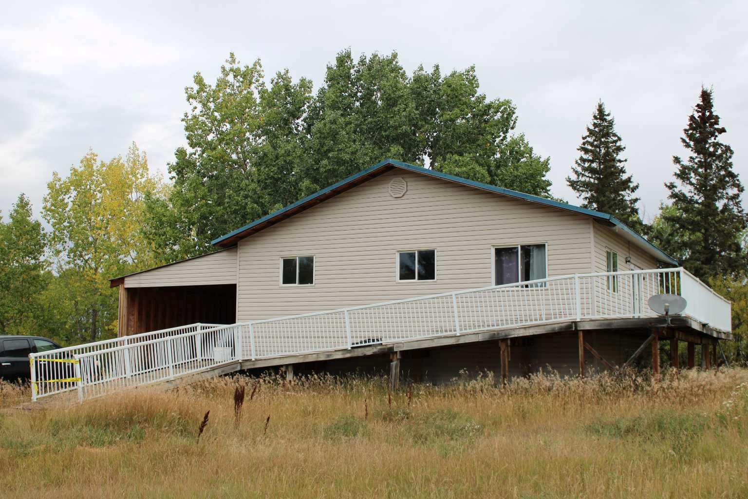 1136 sq. ft. Bi-Level in Peoria in a culdesac. Features 2 large bedrooms, one bathroom, ensuite bathroom area unfinished,  partial concrete basement (undeveloped), large deck, a 16' x 32' carport with concrete floor. Property has a water cistern & sewer is a septic tank. Gas furnace and hot water tank is electric. All offers to have Schedule A in supplements attached.  Property is sold "AS IS, WHERE IS".