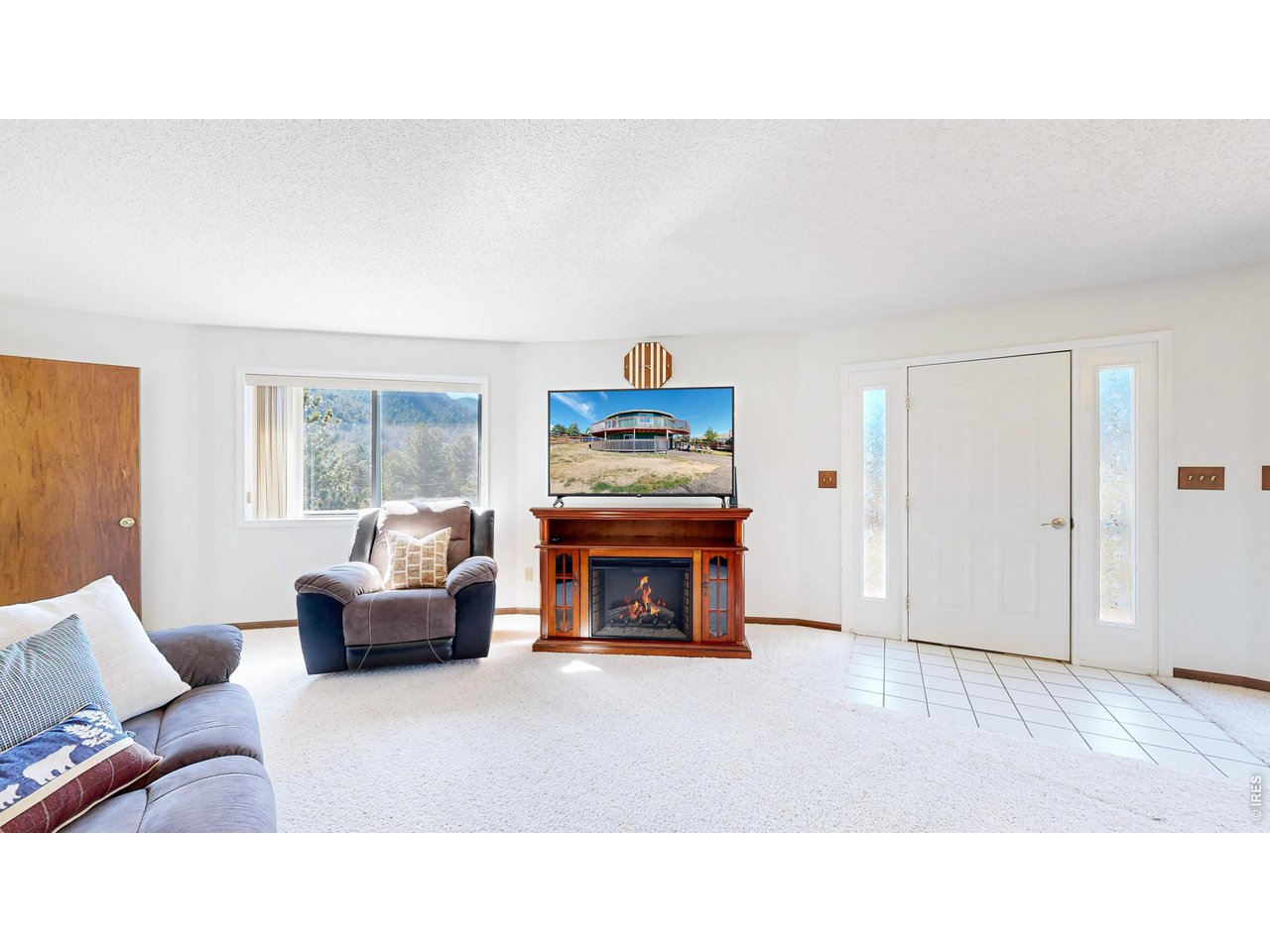 MOTIVATED SELLER - IMPROVED PRICE! Mountain Living with Panoramic Views in Estes Park! Discover the incredible potential of this one-of-a-kind 18-sided Deltec home, ideally located near parks, community ponds, and scenic walking and biking trails in beautiful Estes Park. With 4 bedrooms and 3 bathrooms, this distinctive home is filled with natural light and offers a spacious, versatile layout designed to capture 360-degree mountain views from nearly every angle.The main-floor primary suite provides the ease of one-level living and serves as a private retreat with a generous layout, relaxing Jacuzzi tub, and separate shower. A flexible lower level bonus room offers endless possibilities for a home office, gym, media room, or play space to fit your lifestyle.Recent exterior improvements include a newer roof (2020) along with brand-new siding and trim, giving you a head start while leaving room to add your own personal style and updates inside. Step outside to enjoy Colorado's stunning scenery from the expansive wraparound deck, perfect for entertaining or simply soaking in the panoramic mountain vistas.A standout feature of this property is the extra-large heated garage space - ideal for vehicles, outdoor gear, hobbies, or workshop needs. The fully fenced yard offers privacy and plenty of room for pets, gardening, RV parking, or recreational toys.Priced to reflect its opportunity for cosmetic updates, this truly special property offers the chance to build equity and create your dream mountain retreat in one of Colorado's most sought-after locations. Don't miss the opportunity to own a home as unique as the setting itself!