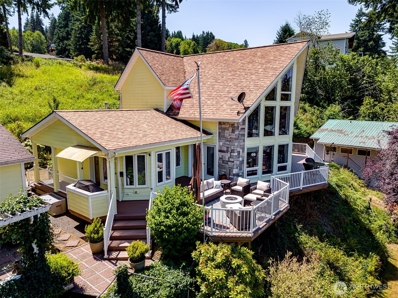 This remarkable home is nestled near Lake Mayfield and has all the amenities for a vacation home, or somewhere you can call home year around! Step inside this home you will be greeted with vaulted ceilings that are finished with wood detail and two stories of windows that showcases the view of the lake. The kitchen offers granite countertops, large island, walk-in pantry and dry bar. The primary boasts a fireplace, ensuite w/ double sinks, soaking tub and walk-in shower. This large lot includes multiple places to park RV's/boats w/ one site having electricity, water and sewer dump. The property also includes a deck, workshop with electricity and two car garage that includes a bathroom. A must-see! Turnkey, Sellers to leave furniture!