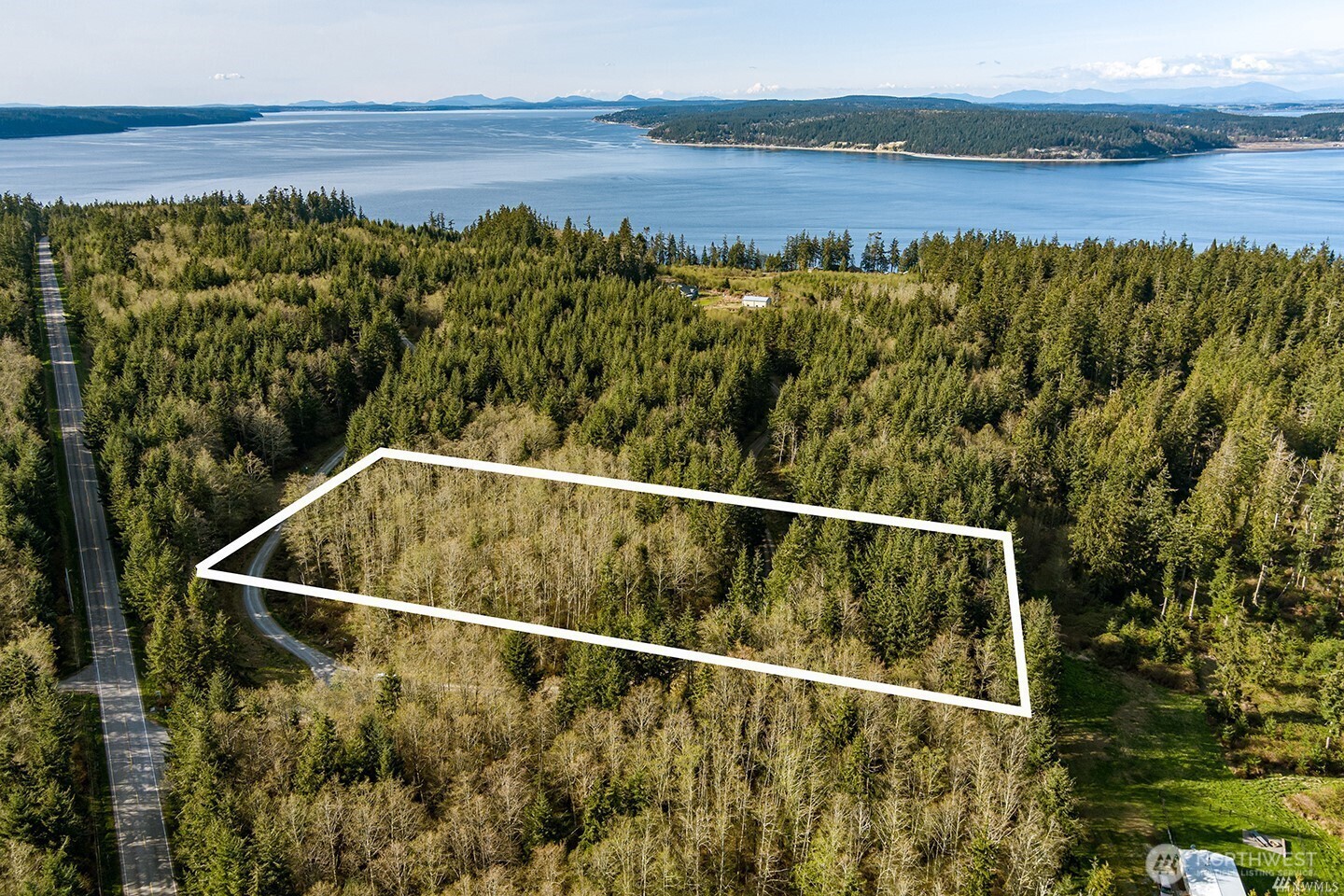 Saratoga View Ridge Estates, which overlooks the scenic marine waterway of Saratoga Passage, is a private Whidbey Island gated community located between the towns of Langley & Freeland. Enjoy 4.13 acres of pristine land & trees making for a stunning building site with its own private nature preserve. Building site offers excellent solar exposure, with a cleared meadow to the east from the neighboring tract.  Relatively easy site to develop w/Utilities available. This lot has private walking trails making it easy to view property & building sites. Imagine yourself relaxing on your new deck, with coffee in hand, taking in the sunrise over the peaceful meadows while listening to the sounds of nature that surround your own personal retreat.