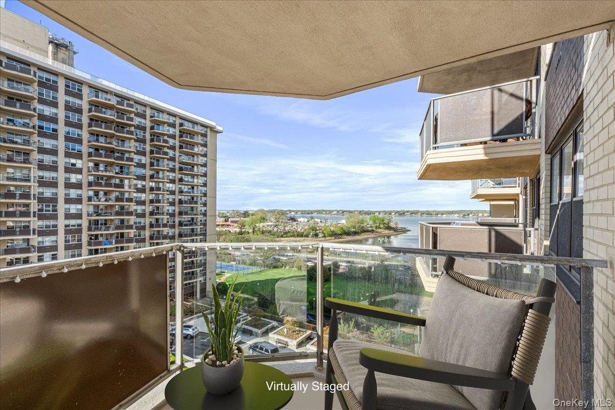 Welcome to this one-bedroom mid-size apartment at The Versailles, perfectly situated within the Towers at Waters Edge with water and Manhattan skyline views. The inviting living room leads directly to a large private terrace, offering a front-row seat to spectacular sunsets over the bay. Inside, timeless parquet wood flooring adds warmth to the airy layout, which includes a dedicated dining area and a functional kitchen. Residents of The Versailles enjoy a premier, full-service lifestyle with a 24-hour doorman, a spacious lobby, a fitness center, and a seasonal heated pool. The community also offers ultimate convenience with an on-site cafe, store, and ample parking options, including a garage and an outdoor lot. Close to Bay Terrace Shopping Center and express transportation to Manhattan, this residence is the perfect retreat for those seeking comfort, convenience, and unparalleled views in the heart of Bayside.
