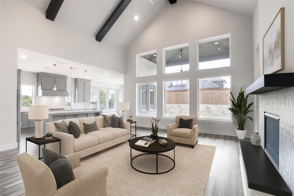 Welcome to one of the most desirable homes in The Grove Frisco, featuring a rare FOUR-CAR garage, spacious corner lot, & exceptional layout designed for comfort, privacy, & modern living. Steps from Explorer Park, this beautiful Southgate home offers ideal blend of tranquility & convenience, w walking trails, multiple parks, resort-style pool, clubhouse, & fitness center all moments from your front door. The home opens with a study w French doors & first-floor guest suite w full bath. Media room w pocket doors is next to LR & kitchen. Primary suite features spa-inspired bath w soaking tub, walk-in shower, dual vanities, & custom closet. Open-concept LR showcases a vaulted ceiling, fireplace, & natural light. LR flows effortlessly into dining area & 3 spacious beds —2 with private en-suite baths & third w nearby full hall bath. Bright & versatile game room offers living flexibility, while built-in workstation in hall is perfect for homework or 2nd workspace. Outdoor living area is designed for year-round enjoyment, w covered patio, pre=wired for mounted TV & fireplace. Private wraparound backyard offers room for future pool, play space, or garden. Walk-in attic access & storage throughout. Local Lifestyle & Walkability: Positioned in one of Frisco’s most sought-after communities, residents enjoy access to nearby dining, coffee, & retail. Within a short walk, grab your morning brew at PJ’s Coffee, enjoy casual dining at The Common Table, or stop by Shipley Do-Nuts for a treat. The Grove’s boutique retail center offers convenient everyday amenities, & larger shopping & entertainment are just minutes away. Top-rated Liberty High School is within walking distance. Combining a rare four-car garage, flexible floor plan, walkable conveniences & premier community amenities, this home offers one of the finest living experiences in Frisco. Welcome Home!