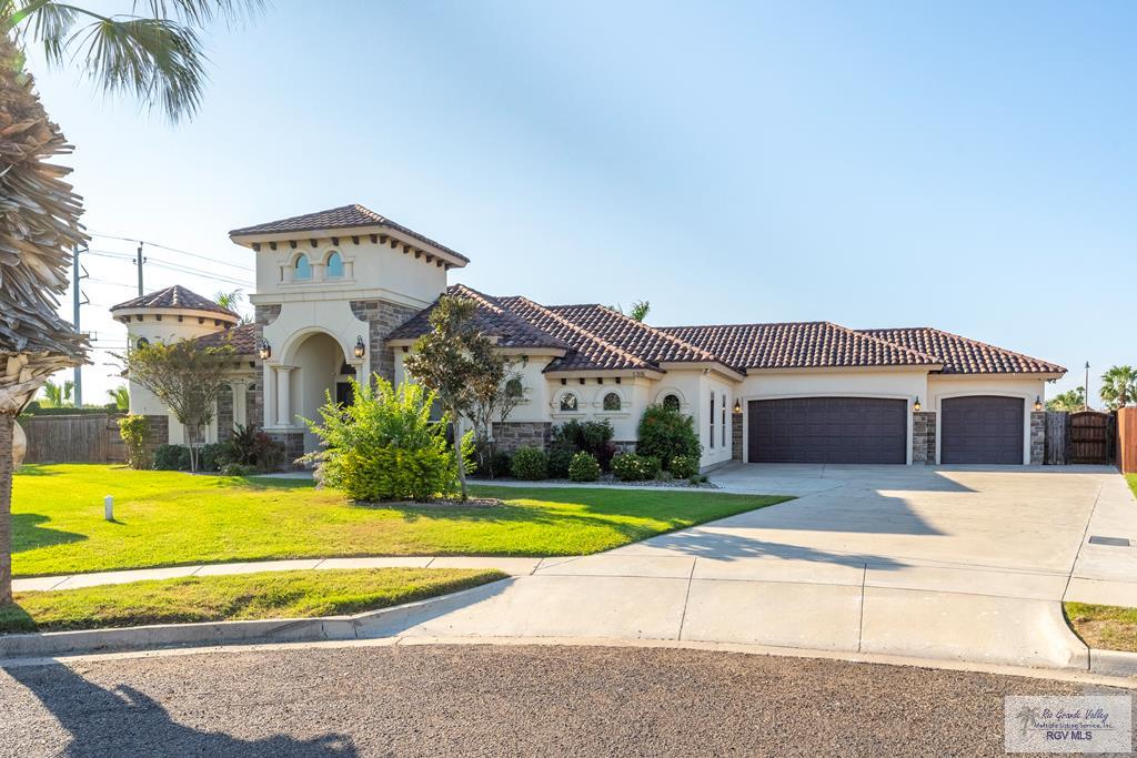 Welcome to this stunning Mediterranean-style Home, gracefully designed for both grand entertaining & everyday comfort.  Sprawling & Spacious The home features an expansive living room, Large dining area, and a beautifully designed open floor plan that creates a seamless flow throughout.  The oversized kitchen, complete with a large center island, abundant cabinetry, and a full suite of appliances-perfect for hosting gatherings large or small.  The thoughtfully planned layout offers excellent privacy with separate bedroom wings, including a well-appointed Jack-and-Jill bathroom. A three-car garage provides ample space for vehicles, storage, and hobbies. Step outside to a true resort-style backyard, where a gorgeous pool anchors the outdoor living space. Enjoy year-round entertaining in the large covered barbecue area, ideal for outdoor dining and relaxation.    Community pool, gym.