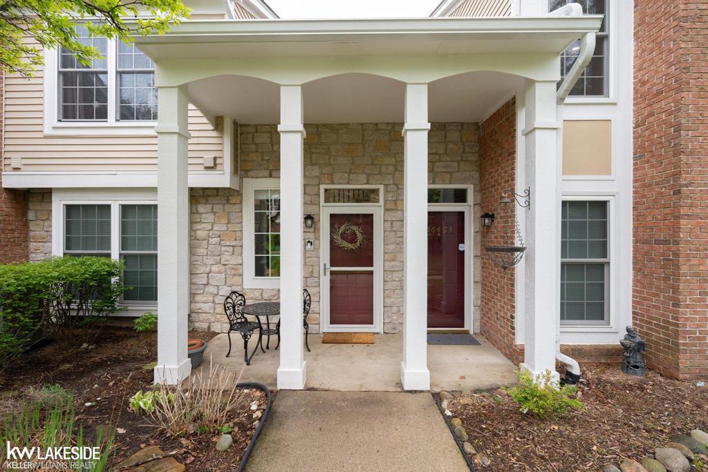 OPEN HOUSE SAT AND SUN 2PM-5PM  Beautifully remodeled, fully updated condo in the desirable Aberdeen Village complex of Shelby Township. This home features a bright, open floor plan that blends modern updates with functional living space. The kitchen includes white shaker cabinets, granite countertops, tile backsplash, stainless steel appliances, and a large island with seating. The open-concept layout connects the kitchen, dining, and living areas, highlighted by updated lighting and new flooring throughout. The spacious primary suite offers a walk-in closet, ceiling fan, private bath access, and direct access to the balcony. Additional updates include in-unit laundry, new furnace, central A/C, water heater, and windows. Enjoy a private balcony with views of landscaped green space, along with well-maintained grounds featuring mature trees. Aberdeen Village offers community amenities including a pool, hot tub, tennis courts, and clubhouse. Conveniently located near shopping, dining, and major freeways. Freshly Painted and Move-in ready.