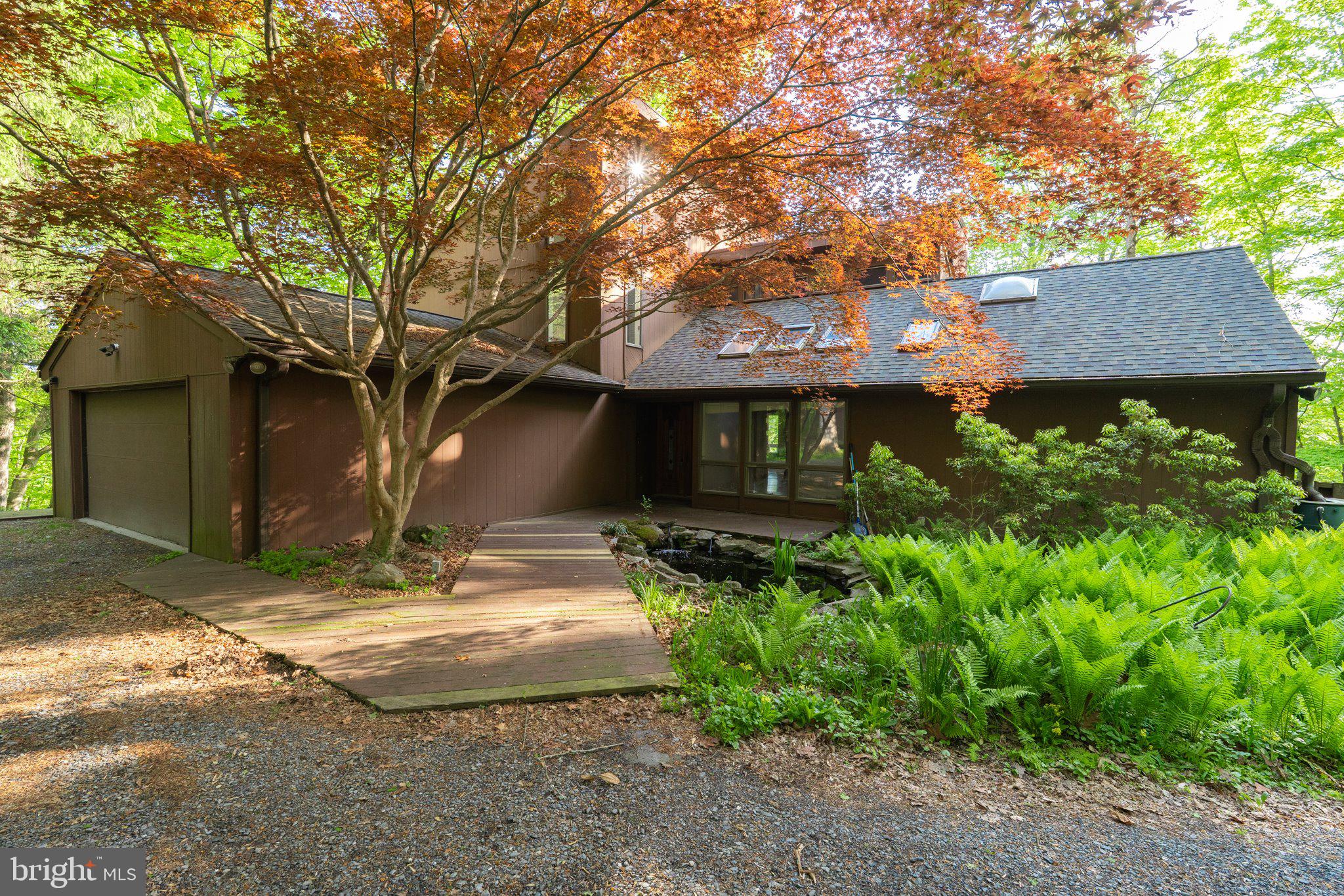 URGENT:  Multiple offers received.  Any and all, highest and best by tomorrow, Tuesday, May 5th by 10 am.  Welcome to 1223 Steamboat Run Road:  A once in a lifetime opportunity to own a commanding view of the Potomac River valley.  This is a custom-built contemporary home built on 8.05 deeply wooded acres with what some would call a "Million-Dollar" view!  Come and look down upon the river valley at approximately 418 feet in elevation and say...Wow!  636 feet of river frontage.  Multiple lots combined to make this 8.05-acre parcel feel like a forested sanctuary.   The Koi Pond provides the sounds of peace and tranquility as you enter this home.  Home attributes:  Glass paneled, wood front door, onto a slate floor foyer.  Office or atrium, you decide, with Koi Pond/wooded views and lots of morning light.  Master bedroom on the main level with wood floors, wood burning stove, dual walk-in closets and a ceramic tile master bath and walk-in/roll-in shower.  Vaulted living room ceilings with sky lights, wood floors, wood paneled wall, exposed beams and large brick fireplace.  Large eat-in kitchen and separate formal dining room with vaulted ceiling. wood paneled walls and views of the river valley.  Rear sunroom with French doors out to multiple deck areas.  Wind up the tower like staircase to two carpeted bedrooms with an adjoining full bath.  Large storage/mud room, main level laundry room with wash basin and separate pantry room with a wall safe.  2 car garage attached garage.  Kohler back-up generator system and NuTone central vacuum system.  Small wood/tool shed and limited fencing to protect views.  This home has so much potential...skies the limit!  Have a vision and enjoy your tour!  Note:  Home is being sold in As-Is condition with the seller to make no repairs.  Steamboat Run has an approximate 20-acre common area for river access and enjoyment on the lower loop.