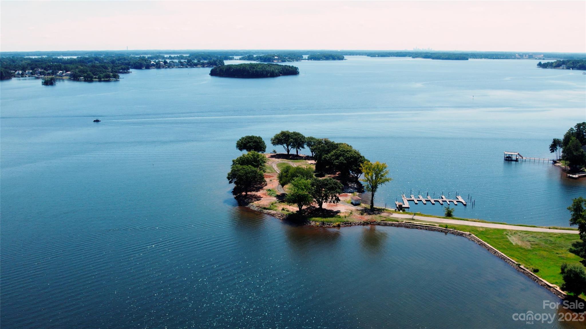The Cape at Mattie Rose is an awe-inspiring community by Grandfather Homes and Greg Perry Design on the pristine shores of Lake Norman. A private, meandering causeway leads its residents and guests to a gated island with lake views surrounded on all sides. Three homesites measure over .7 acre each, creating an idyllic retreat with unlimited outdoor spaces. While money can't buy youth, a home of this caliper is the vehicle and experience to living out that phenomenon everyday. These homes are created to delight your eyes, refresh your soul and provide boundless respite and inspiration. Expect the best in modern living from custom architecture and smart home technology designed to suit your every want and need. Each home features immediate water access, expansive outdoor living and light-soaked living areas. The Cape affords this unique position to design a personal retreat with exceptionally private lake living that is also your abode for expanding the whole mind, body and spirit.