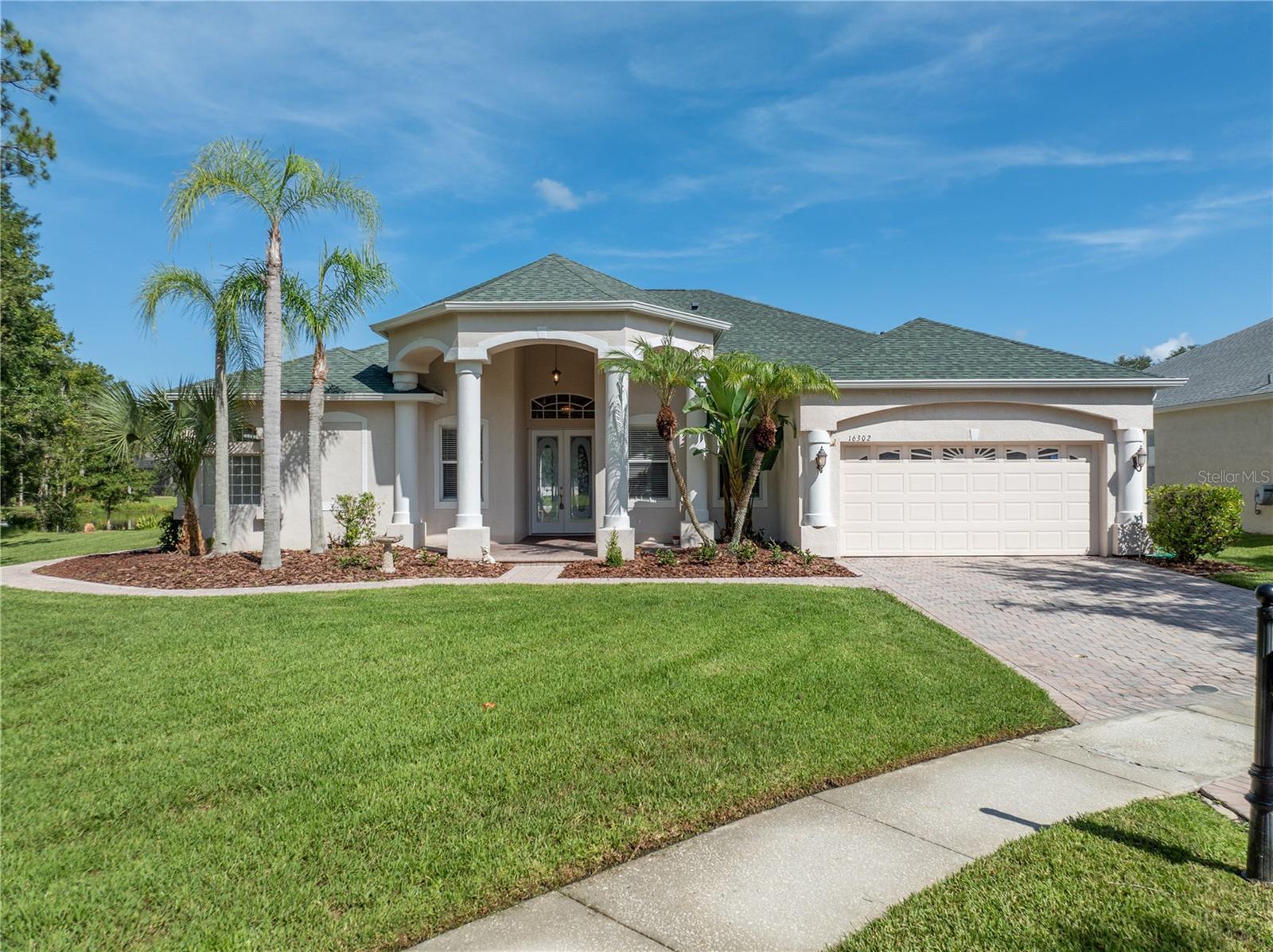 Take a tour of this gorgeous 4 bedrooms, 3 bathrooms, extended 2-car garage, ranch style home, on a cul-de-sac, located in the gated community of Ashington Reserve at Tampa Palms. This breath-taking pool home nestled on a private pond and conservation lot with natural light filling the space, offering views of the pool, serene pond, and lush conservation area through the living room sliders. Heated area 2,720 SqFt, the gourmet kitchen features granite countertops, 42” cabinets, and built in refrigerator. The open family room boasts a cozy gas fireplace, ideal for relaxing evenings. Spacious master retreat with an office and pool access and a luxurious master bath featuring a walk-in tile shower, tub with massage, and dual sinks. Throughout the home, shutters adorn windows, enhancing privacy and style. Bathing under the Florida sunshine, enjoy the tranquility of the pool and overlooking the conservation area where birds and wild animals often gather near the pond's edge. Minutes away from the Club Tampa Palms North, residents can enjoy tennis, golf, pool, SPA, and gym. Easy commute to many shops, restaurants and schools, Tampa Premium Outlet Mall, Wiregrass Mall, USF, Moffitt, Florida & VA Hospitals. I-75 & I-275. Roof (2019), AC (2023), Water Heater (2018). The Seller will contribute $5,000 toward the buyers' closing cost. Make it yours!