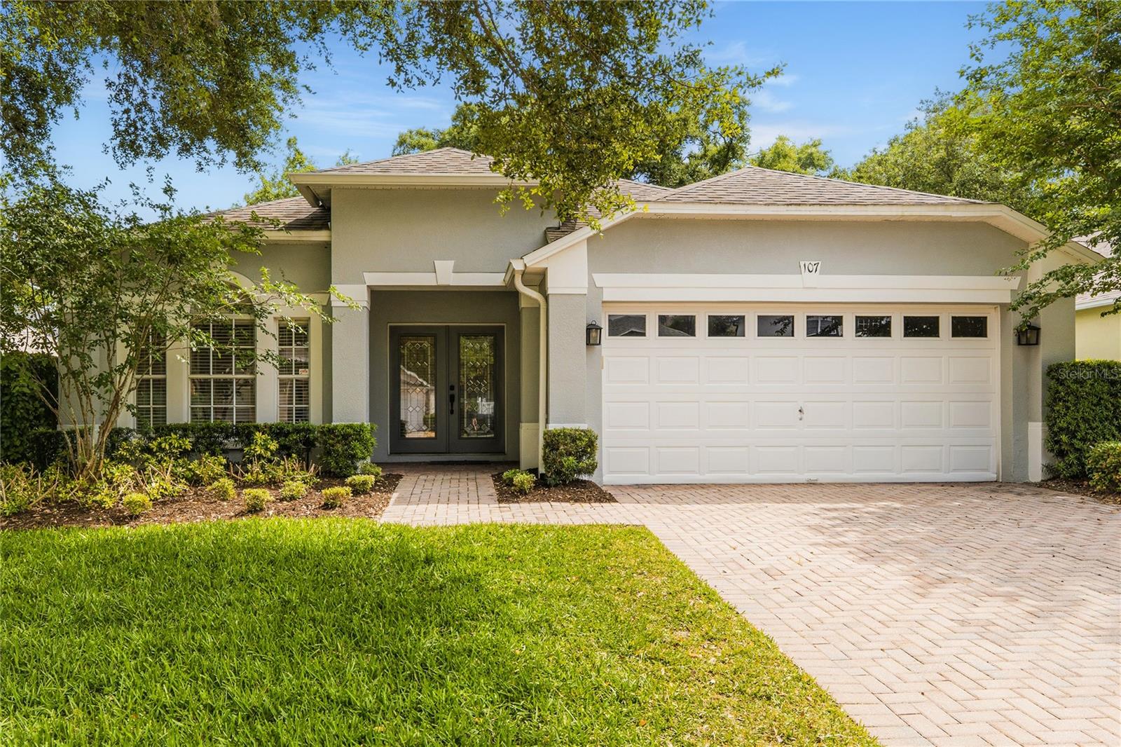 Welcome to Calabria Cove,  where Neighbors Become Family. It’s rare to find an exclusive, tight-knit community where neighbors look out for one another and friendships feel more like family. That’s exactly what makes Calabria Cove so special. This charming enclave of just 33 homes is a sanctuary of warmth and connection a place where newcomers are welcomed with open arms and community pride shines on its street. At the heart of this exceptional neighborhood is a well-designed residence built by Beazer Homes USA, one of the nation’s most respected and trusted builders. Known for their thoughtful floorplans and enduring craftsmanship, Beazer delivers homes that are built to last ensuring peace of mind and quality living for years to come. When you arrive, you will be greeted by an elegant elevation of the homes design and a pavered driveway. Step through the double, glass doors and into an interior where soaring ceilings, art niches, elegant crown molding, and abundant natural light create an inviting atmosphere from the moment you arrive. To the left, doors open to a versatile flex room perfect as a home office, guest suite, to the left of the entry.  The homes plan is very smart with a three-way split plan which offers privacy.  The heart of the home is the dreamy chef’s kitchen, beautiful Cinnamomum Oak cabinetry with stainless steel pulls, with solid surface countertops and a Samsung appliance package. A charming breakfast nook is the perfect spot for casual dining or morning coffee, while the kitchen seamlessly flows into the family room highlighted by luxury vinyl plank flooring, neutral earth tones and natural lighting illuminate the room.  The primary suite is a private retreat, styled in a calming wall with Mindful Grey palette and inlaid wood trim and filled with natural light. The owners bath features a vanity with two sinks a soaking tub with jets , and a separate shower for the ultimate in comfort and relaxation. The two roomy closets feature organizers. Two additional generously sized bedrooms and one shared bath complete the one-story home,  offering flexibility for every lifestyle.  This home has been thoughtfully refreshed and lovingly maintained, with major systems recently replaced ensuring years of worry-free living . French doors lead to a screened and glassed in lanai with a split AC system and a doggie door.  The back yard is fully fenced PVC backyard, where peaceful wooded views provide a private retreat for morning coffee, afternoon gatherings, or laid-back weekends. Beyond the home, Calabria Cove’s boutique community vibe is enhanced by its prime location. Residents enjoy top-rated Seminole County schools, including walking distance to Bentley Elementary and Kirby Park. Updates include Roof 202 , newer A/C & plank flooring. This lovely home is on a quiet, tree-lined street in a gated community north of Orlando in the Sanford/Lake Mary area. It has four bedrooms, three full bathrooms with a gorgeous, breezy sunroom. A great kitchen with a breakfast nook, bar counter and large family living area provide the perfect place to relax. The master suite features his and her walk-in closets, an oversized shower and separate garden tub with jacuzzi-style jets. The fenced-in backyard has an extended lanai and plenty of shade provided by beautiful tall oak trees.