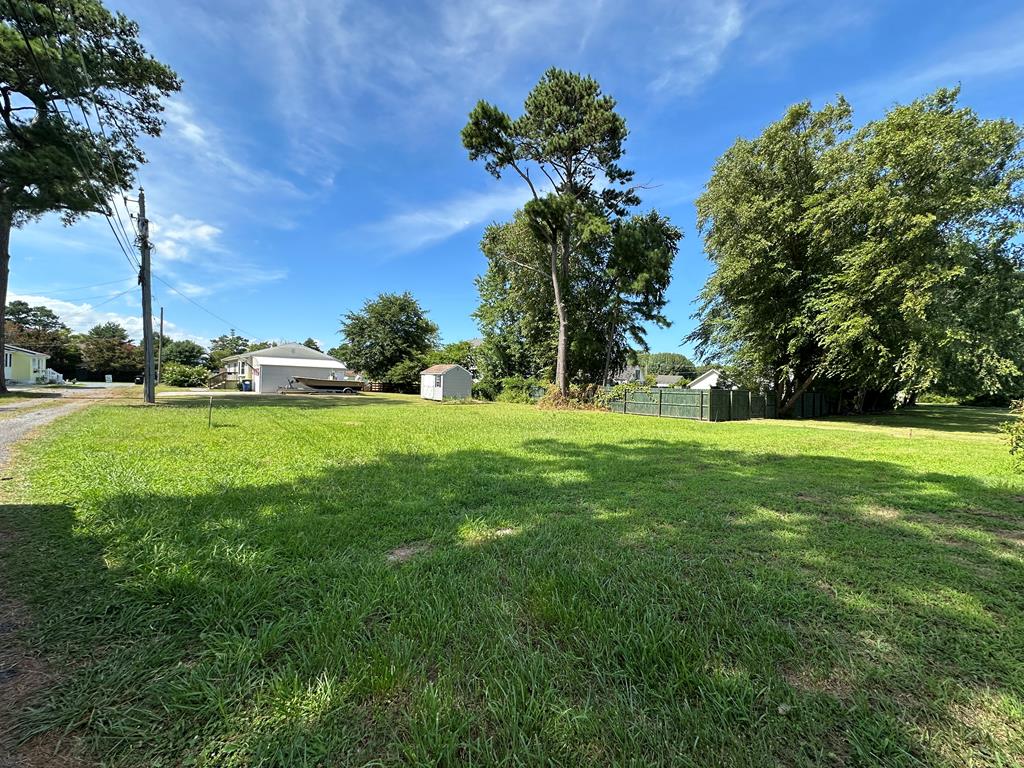 Coastal charm on a quiet island lane, welcome to the perfect spot! Lot is nestled on a quiet side street just moments from the beach offers the perfect place to build the ultimate in relaxed coastal living. Whether you are looking for a vacation getaway, investment property, or full time residence, this lot checks all the boxes.