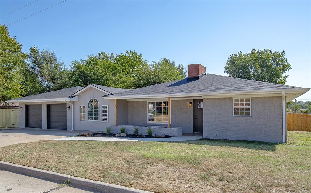 Open this pretty front door, and walk into a beautifully remodeled, welcoming home!  From light fixtures to flooring, this home looks and feels brand new!  The light and airy living area features a wood-burning fireplace, room for family and friends to visit, and opens to a wonderfully, redesigned kitchen, complete with new custom-built cabinets, new countertops, subway tile backsplash, new stainless steel appliances and large stainless sink, complete with new faucet and food disposal.  Great storage and quartz countertop space here, with a wonderful window to allow natural light to flow into your kitchen.  From the living area, enjoy a spacious dining room with space to feed all of your guests, that accesses a roomy screened patio, the garage, and a bath with shower.  Adjacent to the dining room is a flex room, featuring a beamed cathedral ceiling, complete with a closet.  Use this space as a fourth bedroom, a hobby room, a study area or TV room, or whatever need you might have for this light and bright space.   Also, off the living area is a short hallway to the main bath, completed by a jetted tub with a fireplace, a separate shower, vanity with two sinks, and good storage for your toiletries and linens.  Three bedrooms complement this side of the house, and are separated by a hallway with linen storage and additional closet space.  Outside, enjoy the location on a corner lot, eave lights on the street sides of the house, large, fenced patio area with television mount and room for a basketball goal, yard games, or use as additional parking for a car or truck, small RV, or boat.   This house has a brand new roof, and extra insulation was added for more energy efficiency.  This one is move-in ready and waiting for you.  AND, if you use the seller’s preferred lender, you will receive a lender credit of 1% of the loan amount toward closing costs!  Call for your private showing today!