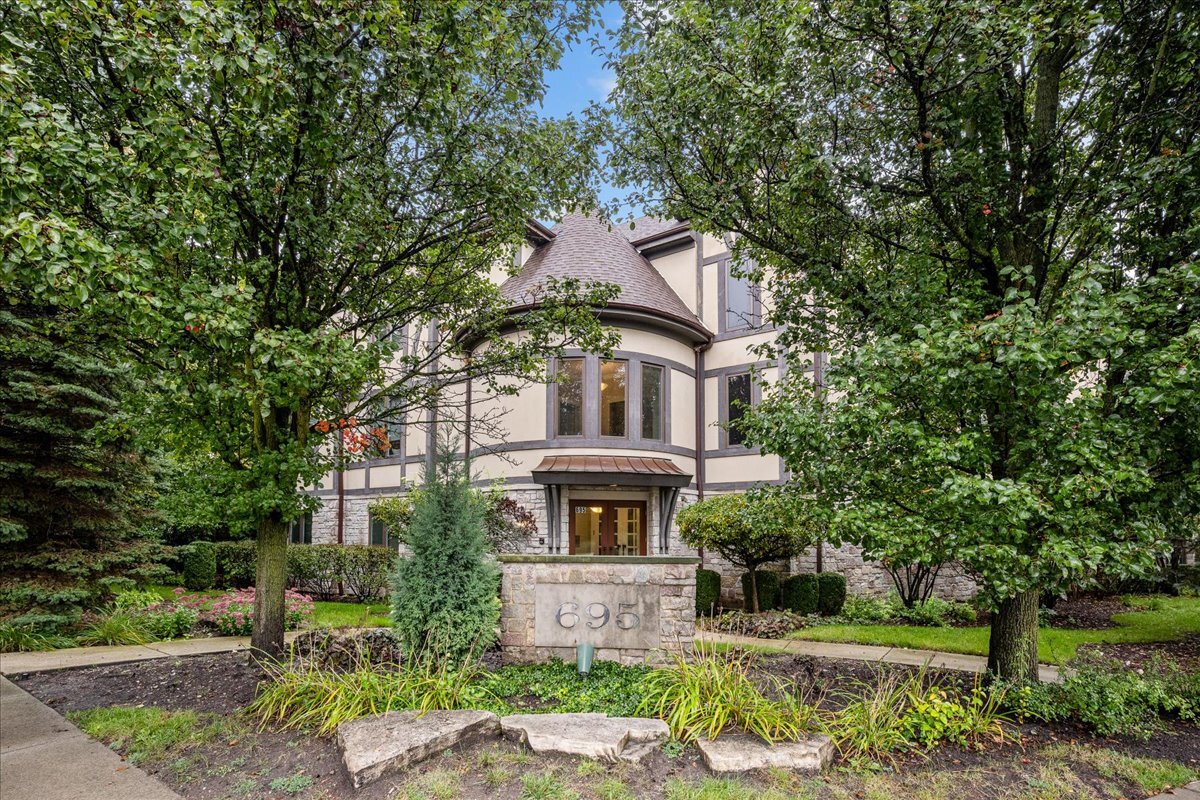 Stunning penthouse condo in the heart of Ravinia! Completely updated and move-in ready with BRAND NEW bathrooms, refinished hardwood floors, new carpet and fresh paint throughout. Soaring ceilings, abundant natural light and beautiful treetop views create a bright and open feel. A formal rotunda entry with crown molding and guest closet opens to the expansive great room with an oversized living area and spacious kitchen featuring white cabinetry, granite countertops, center island and stainless steel appliances. The primary suite offers a large walk-in closet and brand new spa-like bath with double vanities, soaking tub, separate shower and private commode area with frosted glass wall. In-unit laundry is conveniently located just off the primary bedroom. Upstairs, the versatile loft features excellent closet space and is perfect as a second bedroom, office or guest suite, with an additional full bath featuring a subway tile shower and vanity. Additional highlights include a private balcony, heated garage parking, separate storage unit and two additional large walk-in closets. Fantastic Ravinia location just steps to the Metra, Green Bay Trail, shopping, restaurants and Ravinia Festival, with Lake Michigan nearby. A rare combination of space, updates and location!