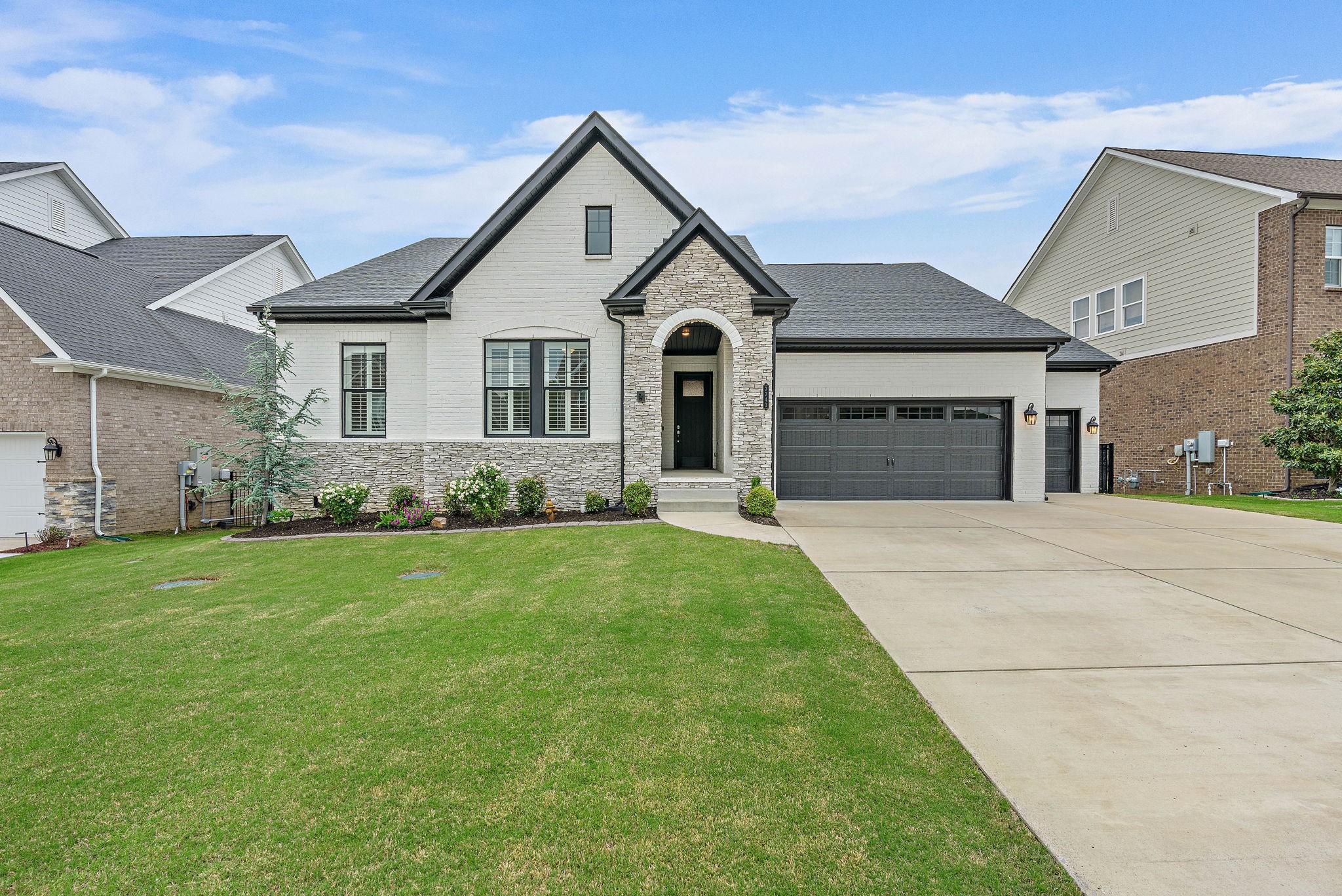 SELLER OFFERING $27K IN CLOSING COSTS WITH PREFERRED LENDER WITH 2/1 BUYDOWN. One level living in Nolensville, five minutes away from downtown Nolensville. This 4-bedroom, 3.5-bathroom home with a dedicated office, located in the highly desirable Enclave at Dove Lake in Nolensville is ready for its new owners. The open floor plan connects the living room, dining area, kitchen, and a cozy seating nook to create a warm, versatile space for everyday life and entertaining. The gourmet kitchen features a five-burner gas stove and a massive island perfect for meal prep, seating, and conversation. The primary suite offers tray ceilings, peaceful views of the tree-lined backyard, and a spa-inspired bathroom with double vanities and a luxurious dual shower. The walk in primary closet has wood shelves and has plenty of space for all your needs. Step outside to a screened-in Trex deck that overlooks a private backyard with turf play space and a large workshop area in the crawl space below. With over 700+ square feet of space in the crawl space for storage, workshop, wood working, etc., its a great addition to an already amazing home. One of the home’s most unique features is the climate-controlled 4-car tandem garage — currently used as a man cave, parking for cars and home gym — offering flexible space for vehicles, storage, and hobbies. Experience true luxury with the home's motorized blinds and elegant plantation shutters. Located just minutes from Nolensville’s charming restaurants, local shops, farmers market, and seasonal festivals, this home also enjoys access to a neighborhood pool and large green space directly across the street. The friendly, close-knit community hosts an incredible Fourth of July fireworks show each year, making this home not just a place to live, but a place to belong. Neighborhood pool is a quick walk across the street. Don’t miss this opportunity to own a beautiful one level home on a private, scenic lot in one of Nolensville’s best neighborhoods