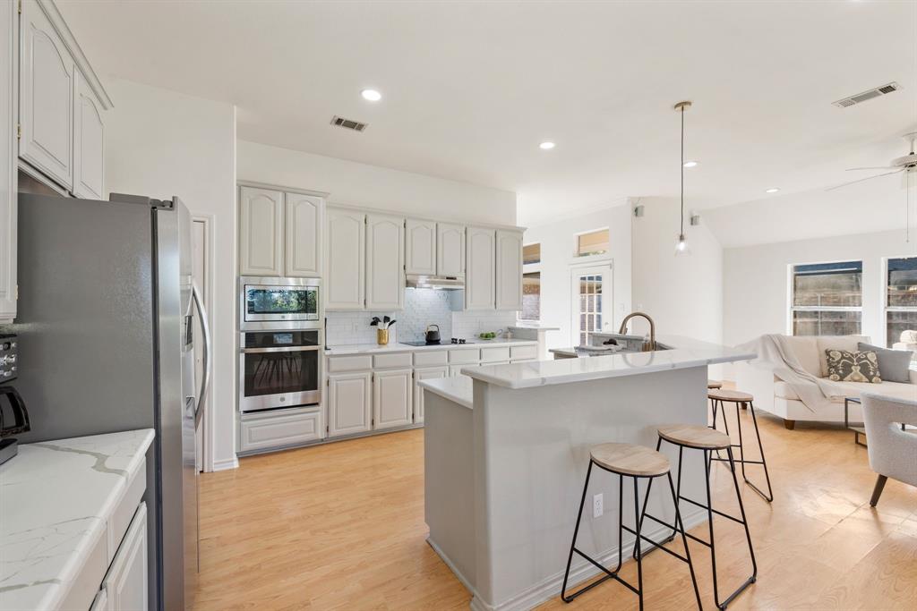 Prime Colleyville Location! Nestled in the heart of Colleyville, this charming 1.5 story brick home offers the perfect blend of style, comfort, and convenience. Ideally situated within walking distance to Bransford Elementary, Colleyville City Park, the public library, and The Village at Colleyville with its upscale shopping and dining. This home truly puts everything at your fingertips! Step inside to discover an inviting open floor plan featuring a fully updated kitchen (2024) with sleek quartz countertops, stainless steel appliances, designer lighting, and a breakfast bar ideal for casual dining or entertaining. A cozy wood-burning fireplace that adds warmth and character. The bathrooms have been tastefully refreshed, and fresh paint and plush carpeting (2025) enhance the home’s modern appeal. Upstairs Bonus Room! The fenced backyard offers plenty of space to relax and play, complete with lush green grass and a charming covered porch perfect for morning coffee or evening unwinding. Enjoy Colleyville’s exceptional lifestyle with nearby parks, trails, and city amenities. Plus, take advantage of quick and easy access to DFW Airport, Highways 121, 114, and 360, making commutes to Dallas or Fort Worth effortless.