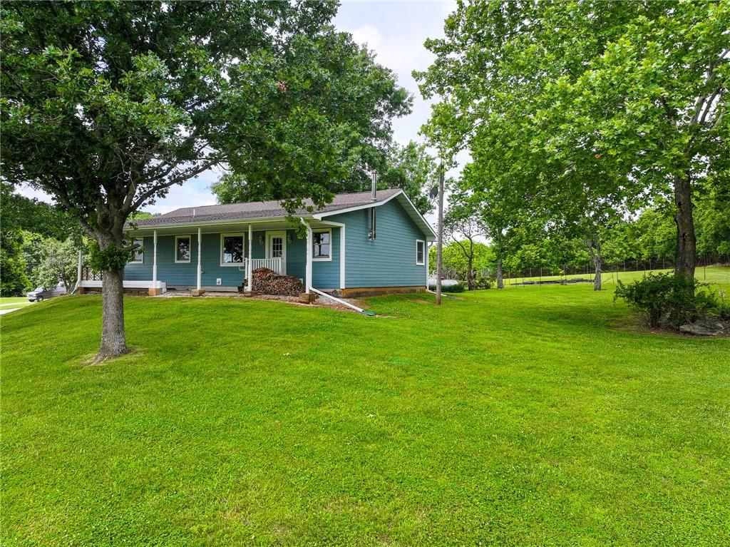 Tucked away at the end of a quiet private road in Collins, Missouri, this 3-bedroom, 2-bath home is the kind of place you can truly settle into. With 2,500 square feet of living space, it strikes a great balance between comfort and character--featuring hardwood floors, detailed crown molding, and just enough antique charm to make it feel warm and inviting without losing that polished look. The finished walkout basement adds even more room to spread out, with its own kitchen and bathroom providing ample entertainment space.Step outside and you'll find 81+\- acres that really speak for themselves It's mostly wooded, giving you that peaceful, tucked-away feel, but there's also a small pond and open, fenced areas ready for horses or livestock. If you enjoy gardening, you'll love the large fenced-in garden--complete with peach, pear, and pecan trees and grapes--and protected with a 9-foot deer fence so your hard work stays yours.The extras here really make the property stand out. There's a 30x40 shop with two heated rooms (and one cooled), perfect for projects, storage, or a workspace. A cozy little ''she shed'' with electricity gives you a quiet place to unwind or get creative, and there's even a well-kept storm shelter right in the yard. With plenty of deer and turkey around, it's a great spot for hunting--or just soaking in the kind of quiet, natural beauty that's getting harder to find.
