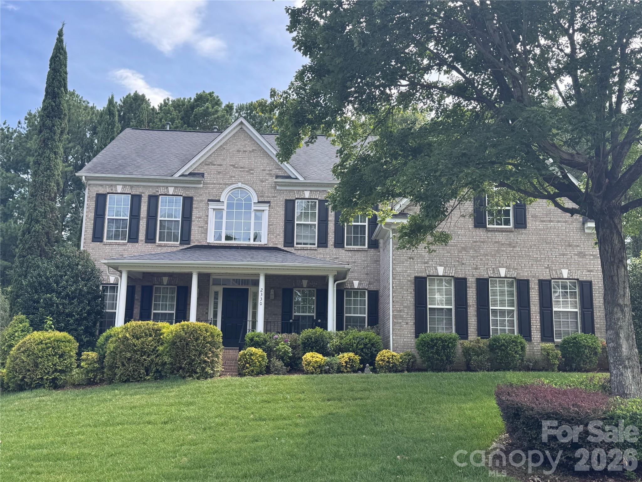 Welcome home to one of Fort Mill's most sought-after communities where award-winning schools, vibrant neighborhood life, and an unbeatable location come together in one exceptional package.  Step inside and be greeted by a dramatic two-story foyer that sets the tone for the open, airy living spaces throughout. The main floor is thoughtfully designed for real life a true open-concept layout keeps everyone connected whether you're prepping in the kitchen or relaxing in the soaring two-story family room. Hosting is effortless with a convenient half bath for guests, and the added bonus of a private bedroom and full bathroom on the main level offers ideal flexibility for multigenerational living or visiting guests.  Upstairs, escape to a generous primary suite complete with a beautiful ensuite featuring a like-new corner jacuzzi tub the perfect place to unwind after a long day. Three additional nicely sized secondary bedrooms and a full bath round out the upper level, offering plenty of room for everyone.  Outside your front door, the community delivers a true resort lifestyle: splash away at the resort-style pool, let the kids play at the playground, and take advantage of a full calendar of neighborhood events from food truck nights and a springtime egg hunt to the beloved back-to-school ice cream social, Halloween parade, and movies by the pool. This is the kind of neighborhood where neighbors become friends.  The location is simply unmatched. Just minutes from downtown Fort Mill's restaurants, the local library, and scenic Greenway trails, with easy access to the Lake Wylie boat ramp for weekend adventures on the water. Commuters will love being only 20 minutes from Uptown Charlotte and Charlotte Douglas International Airport. Add in the benefit of low South Carolina property taxes and attendance in Fort Mill's award-winning school district, and this home truly checks every box.  Come see why Fort Mill is one of the Carolinas' most desirable places to call home and make this incredible property yours!