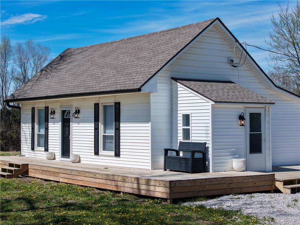 Turnkey perfection! Cozy home on 3 acres with Brand New Systems installed and a complete remodel inside and outside in 2025. Move right in and relax in this charming country retreat that is completely turnkey, featuring a new roof, new HVAC system, new windows, new propane tank, a large storage unit, and a new septic system for total peace of mind. The heart of the home is a fully updated kitchen with modern finishes including stainless-steel appliances, a lovely kitchen island and LVT flooring throughout the home. You get the convenience of a manageable home with the freedom of three expansive, private acres. Don't miss the rare opportunity for a chance of making this tranquil home in the country your very own.