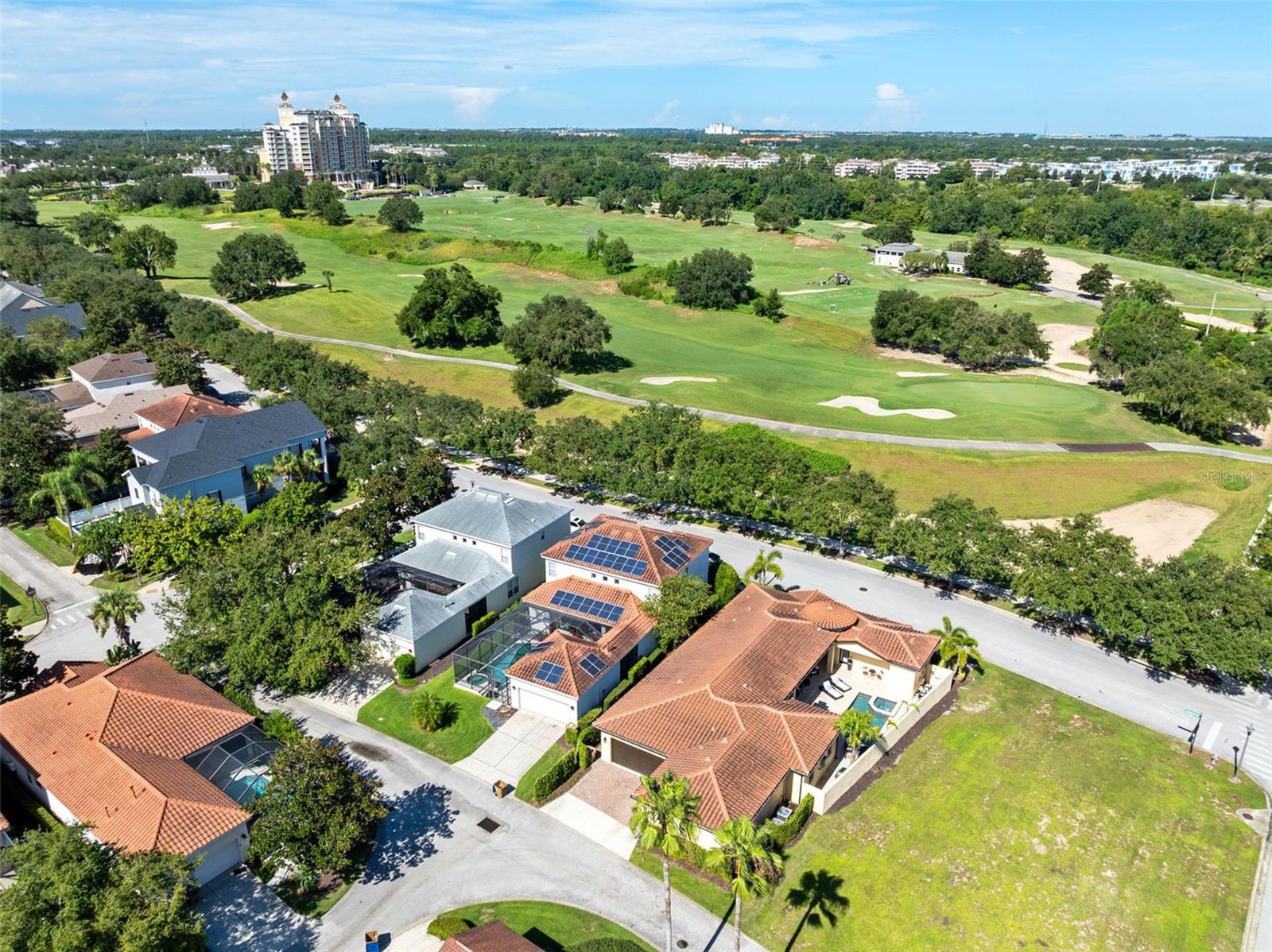Under contract-accepting backup offers. In the heart of Reunion Resort’s sought-after Homestead neighborhood, this rare single-story luxury custom home offers a balance of privacy, elegance and resort-style living. Framed by front-facing views of the Tom Watson golf course and designed around a sun-drenched walled courtyard with a sparkling pool and spa, the home invites a sense of calm and retreat the moment you enter. Arched patio doors open from the main living area and the expansive primary suite, creating a seamless connection to the tranquil outdoor space. Inside, the style blends timeless Spanish architecture with warm, transitional interiors, enhanced by a variety of surprising architectural details that add charm and character throughout. Beamed ceilings, a cozy fireplace and elegant Ethan Allen furnishings anchor the open-concept living and dining space, while twin archways lead to a beautifully appointed farmhouse kitchen featuring a Thermador range and built-in high quality appliances, walk-in pantry, and a custom eat-in design with built-in seating for four—a seamless extension of the expansive kitchen counter that makes gathering effortless and inviting. The private primary suite is a sanctuary, complete with its own fireplace, 70-inch television, refreshment bar, spa-like bath with a gleaming freestanding tub, and a custom walk-in closet, plus a bonus room ideal for a gym, office, or additional dressing room. Three additional bedrooms include a separate casita with private entry, ideal for guests or extended family. Offered fully furnished and ready for immediate enjoyment, the home also has an active Reunion Club membership granting optional access to the resort’s world-class amenities—three signature golf courses, a five-acre water park, tennis and pickleball, fitness centers, restaurants and more—and even comes with a golf cart for exploring the community in true resort style. Just six miles from Walt Disney World and under 30 miles to Orlando International Airport, this home offers not just a place to live, but a lifestyle to fall in love with. Qualified buyers may receive a one-year interest rate buydown for the first year paid for by the seller's preferred lender when financing this home (subject to credit approval and program availability) so call today for details.