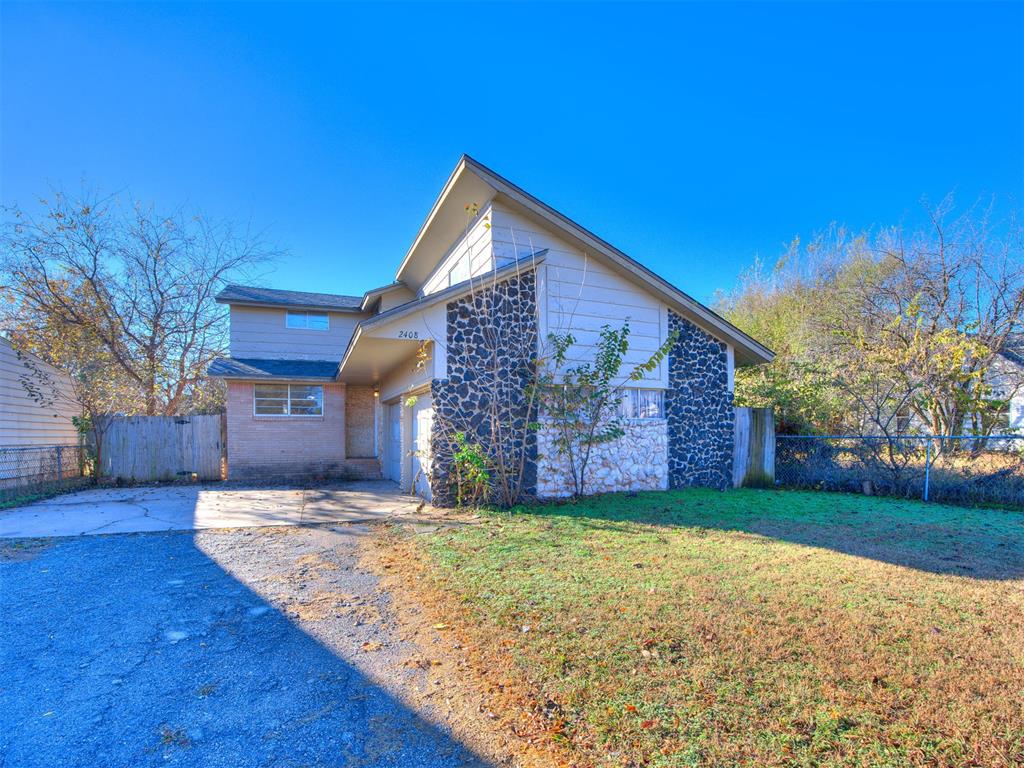 Excellent opportunity to make this home your own with unique features like a gemstone wall that glistens in the sun on the front of the property & a darling stone entry. As you enter the property, you are greeted with flagstone flooring & a spacious living room! Updated kitchen with a dining space that features a fireplace. The primary comfortably sits privately on the 1st floor! The home also features 2 bedrooms upstairs with special features like the gemstone accent wall in 1 room & beautiful stained beams in the vaulted ceiling. There is also a full basement with a 1/2 bath!