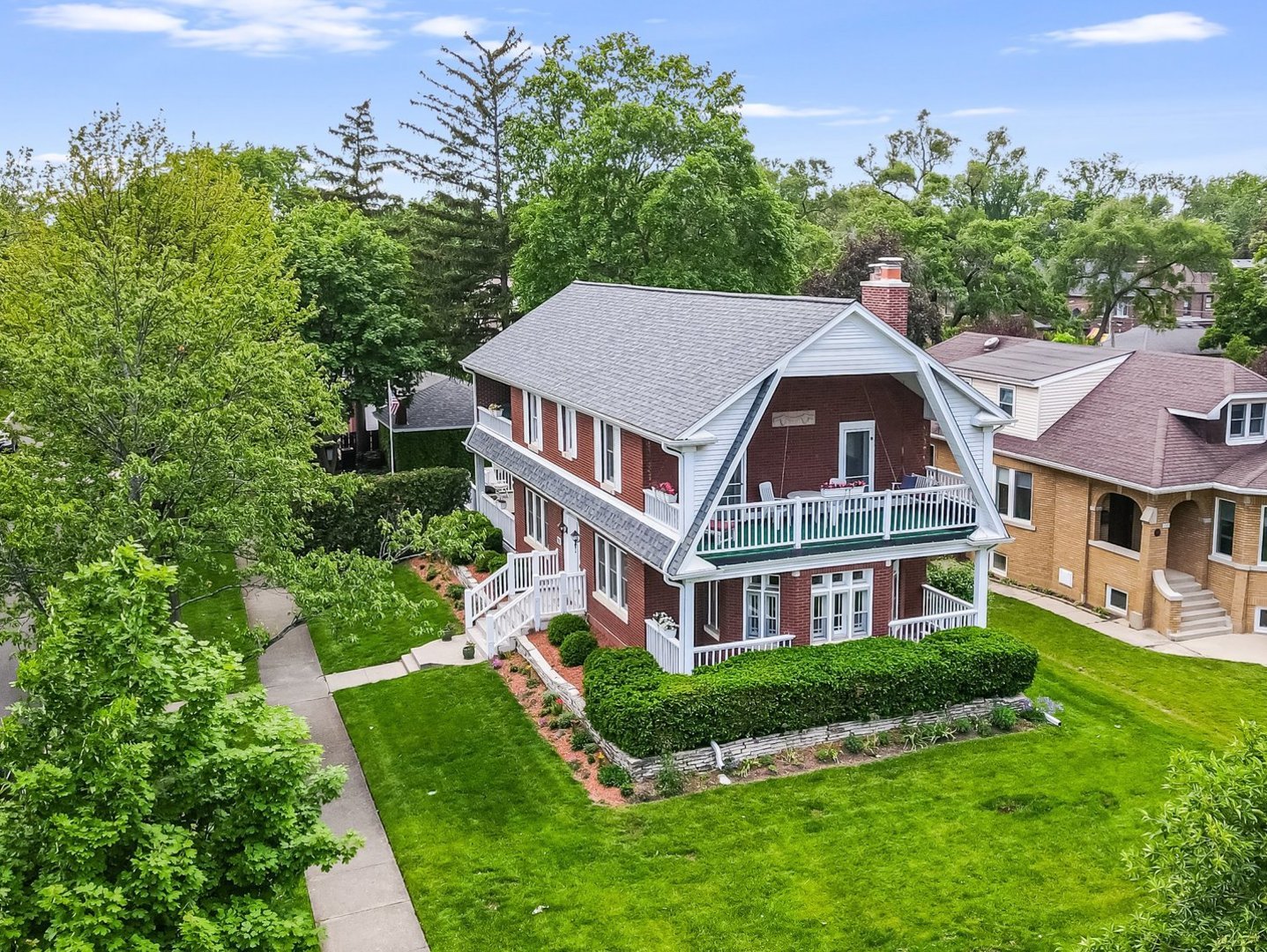Step into timeless charm and modern comfort with this stunning Dutch Colonial, perfectly perched on an oversized corner lot just blocks from Uptown Park Ridge and the Metra. This triple-brick beauty showcases classic craftsmanship paired with thoughtful updates throughout, including mostly new Pella windows. The elegant octagon living room, centered around a cozy fireplace (chimney and liner both replaced within the last five years), offers a unique and welcoming space to relax or host guests. You'll love the updated kitchen that seamlessly flows into the inviting family room and opens to a generous backyard, complete with a deck, fire pit, and underground sprinkler system - perfect for effortless maintenance and outdoor entertaining. Multiple balconies offer beautiful spaces to unwind, including a second-floor deck with a swing and access from the bedrooms. The spacious primary suite is a true retreat, featuring a private bath and direct outdoor access to a balcony. There's also second-floor laundry. The basement adds exceptional flexibility for a rec room, gym, or guest space, and includes an additional washer and dryer, and a freezer. Ample storage can be found throughout the home, including in the attic of the detached two car garage accessible from the alley. With an updated kitchen and bathrooms, plus recent improvements like the roof, gutters, and windows, this home is completely move-in ready. Classic style, unbeatable location, and everyday comfort - all in one.