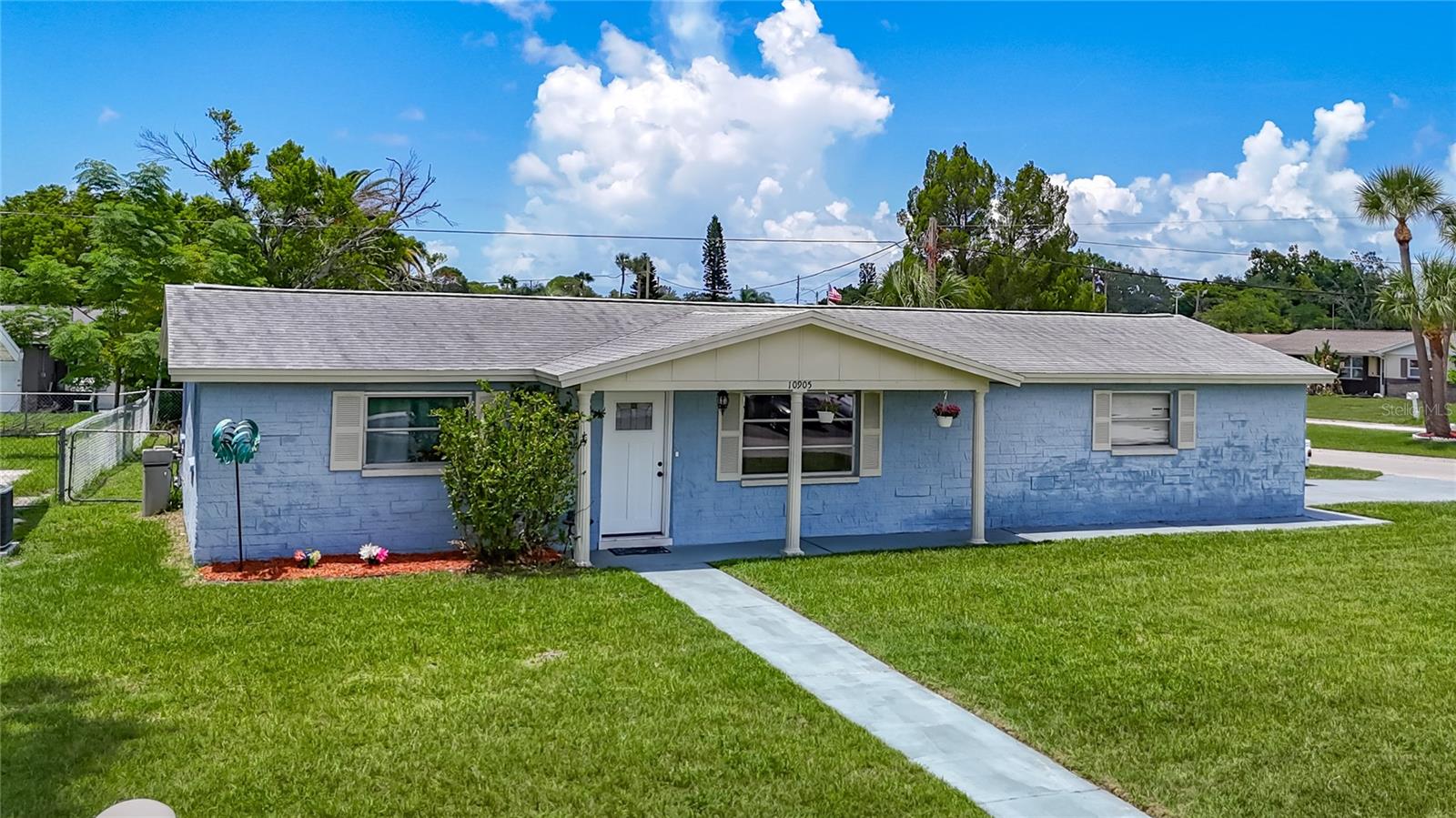 Ideal for First-Time Buyers, Downsizers, or Investors! This beautifully remodeled turnkey 2-bedroom, 2-bath block home with an oversized 2-car garage sits on a spacious corner lot and is ready for you to move right in. Step inside to discover bright, open living areas with an open-concept floor plan, perfect for both everyday living and entertaining. The updated kitchen boasts modern cabinetry, granite countertops, and a center island—ideal for gathering and cooking. Need a home office? A dedicated den/office space provides the perfect spot to work remotely or enjoy a quiet retreat.  Both bathrooms have been refreshed with new vanities and low-flow toilets. You'll also love the new luxury vinyl plank flooring, newer A/C unit (2023), and a brand-new tankless water heater (2025). The roof was replaced in 2015, and the upgrades don’t stop there!  The oversized garage offers ample room for storage or a potential workshop setup. Outside, the fully fenced huge backyard is ideal for pets, play, or extra parking—there's plenty of room for a boat, RV, or truck.  With no HOA and low property taxes, this home is a rare find and an excellent value!  Make sure you check out the 3D Virtual Walk and video!