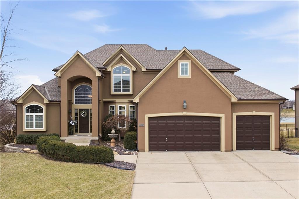 Experience the ultimate lifestyle in the premier Raintree Lake subdivision with this expansive floor plan featuring 4 bedrooms, 4 full bathrooms, and 1 half bath, including a versatile non-conforming 5th bedroom in the finished basement perfect for guests or a home office. Located within the highly-regarded Raymore-Peculiar School District, the home offers sun-drenched living areas and exclusive community access to a 440-acre private lake, Olympic-sized pool, and scenic walking trails. Situated on a corner lot with views of the water, this stunning residence at 701 SW Admiral Byrd Dr offers an unparalleled blend of space, style, and resort-style luxury.