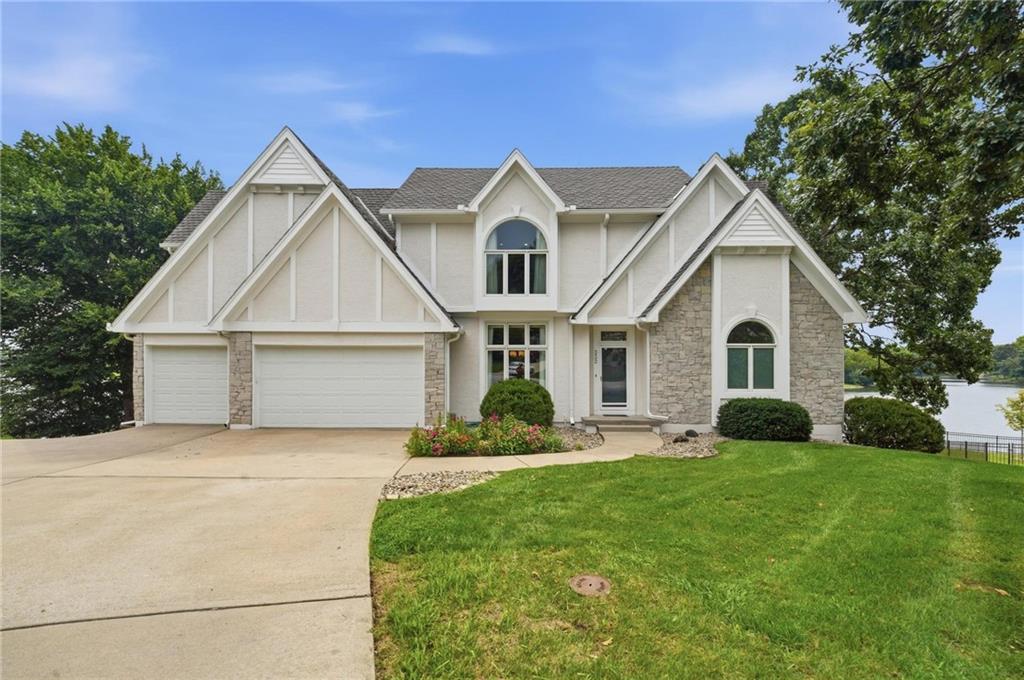 Over 160' of east facing lakefront! Landmark home in Lakewood offers more than 5000 sqft of finished living space over 3 levels. All stucco exterior with stone trim, freshly painted! Epa (Brazilian cherry) wood deck is stunning & freshly sealed. This custom home sits on beautiful lakefront lot with stone sea wall. Level driveway leads to 4 car garage (3rd bay is 31'deep/tandem) with custom Garage Tek system & epoxy floor. Additional driveway beside home leads to side entry garage with space for 2 cars, or boat & workshop, epoxy floor. Front door opens to 2 story entry and open plan with stunning views of lake through floor-to-ceiling windows! Great room has gas fireplace, access to enclosed sunroom offering panoramic lake views. Dream kitchen has tons of cabinets, counterspace with center island, long bar area with seating, open to breakfast room & walls of windows & full glass door offering lake views & access to large deck. Double oven, cooktop with downdraft vent, microwave, dishwasher, trash compactor & fridge! Fantastic back hallway with 2nd full fridge, pantry & laundry room. Primary suite is private & spacious w/fantastic walk-in closet & luxury bath with large soak tub, updated dbl vanity with granite top & large tiled shower. Upstairs, 4 huge bedrooms, 2 bathrooms with updated granite vanities, tiled shower walls w/custom niches. Newer carpet. HUGE walk-in closets. Lower level made for entertaining-family room w/2nd gas fireplace, wetbar & full bath. Sauna. Outdoor entertaining is 2nd to none - lower level Epa wood deck has 13x20 open deck with low rail & incredible lake views, 17x11 covered deck. Just few steps down to level backyard, stone path to steps to lake! Enjoy afternoon shade since lakefront side of home is EAST facing! Full lot irrigation is lake fed. Stone seawall with lights, and stone steps to water. Rare opportunity for this lakefront estate home.