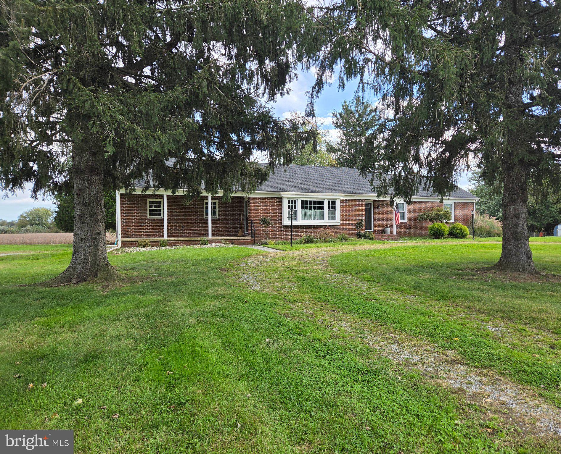 Welcome to this lovely 3-bed, 2-bath brick rancher located in Mannington Twp of Salem County. The home is set on a 0.38 acre lot. The floor plan presents an inviting living room, open to the large dining area which is open to the large and cook-friendly kitchen with ample cabinetry, ideal for family living and gatherings. Primary bedroom with large closets and its own walk-in shower bathroom. Two additional ample-sized bedrooms make this a great home for a growing family. The partially finished basement has its own fireplace and provides additional space for recreation, along with a large unfinished storage and utility area. There's also a walk-up attic for additional storage. The exterior boasts a side-entry 2-car attached garage and an abundance of driveway parking for family and guests. This home is ready for your personal effects. Being sold as-is. Make your private showing appointment today!