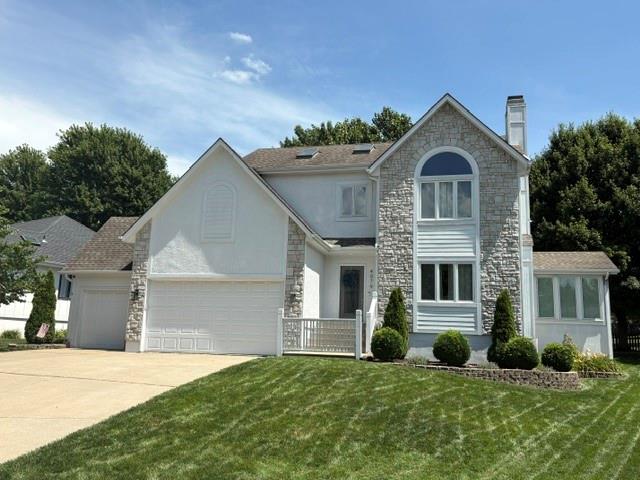 This property sold prior to Active Date. Beautiful Raintree Lake views and immediate waterfront access await you! This meticulously maintained, pet-free and smoke-free home features 3 bedrooms on the main levels plus an expansive, non-conforming 4th bedroom in the finished lower level. Step inside to find a stunning kitchen updated with crisp white cabinetry and a dedicated pantry, a sun-drenched sunroom, and a formal dining room featuring its own cozy fireplace. The spacious living room plays host to a second fireplace, perfect for gathering. Upstairs on the bedroom level, the massive primary suite functions as a true retreat, boasting two closets, private access to additional bonus storage, and a primary bath equipped with luxurious heated floors. The convenience continues with bedroom-level laundry!The walk-out basement is complete with a beautiful wet bar, beverage fridge, and a half bath that is already plumbed to easily add a shower. Outside, the property features a 3-car garage, an automated sprinkler system, and dedicated gas lines in the backyard ready for your fire pit and gas grill. Walk right out your back door down the sidewalk directly to the water! Enjoy resort-style living with Raintree Lake clubhouse access, community pool, and miles of scenic walking trails.