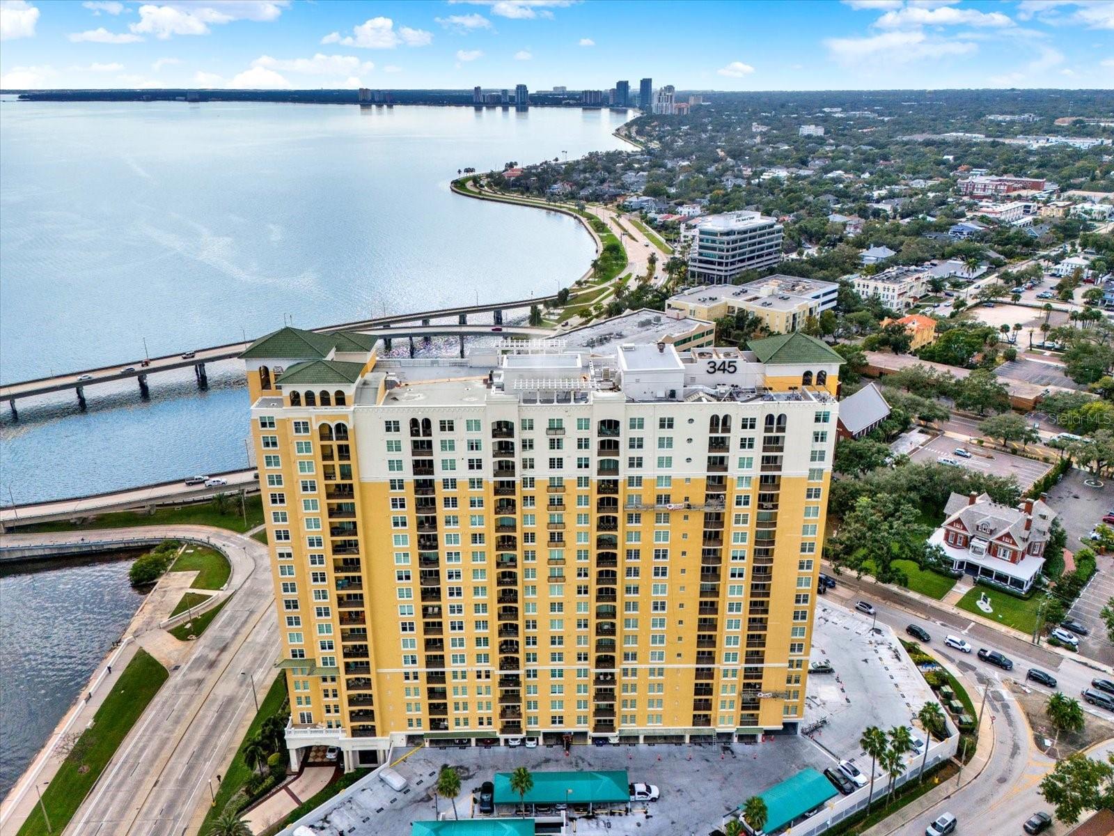 True beauty shines bright and this Bayshore condo is no exception. Located in the desirable 345 Building on iconic Bayshore Boulevard, this beautifully updated residence offers modern upgrades, timeless style, and an unbeatable South Tampa location. This 2-bed, 2-bath residence was completely remodeled from top to bottom in 2024. This ideally positioned unit features views of Bayshore Boulevard, the bay, and Harbour Island. Positioned at the end of the hallway, the unit enjoys a quiet, private entry feel. Inside, the thoughtfully designed layout feels perfectly proportioned with a kitchen that opens seamlessly to the living area, ideal for both everyday living and entertaining. The kitchen features quartz countertops, generous storage, and like new appliances. Step outside onto the inviting patio, perfect for morning coffee or winding down in the evening breeze. The primary suite is spacious and serene, offering a walk-in closet and new flooring which runs throughout unit. The primary bath feels like a retreat, highlighted by a custom walk-in shower, expanded storage, new cabinetry, countertops, and designer tile. Residents enjoy 24-hour front desk concierge service, club room, conference room, bike storage, wine lockers, kayak and paddleboard storage, EV charging, and a lobby library. The 345 Building also offers a new roof (2024). Ideally located along Bayshore Boulevard, just moments from Tampa General Hospital, Hyde Park Village, Downtown Tampa, and Harbour Island. Beautifully renovated units like this rarely come available—and won't last long.