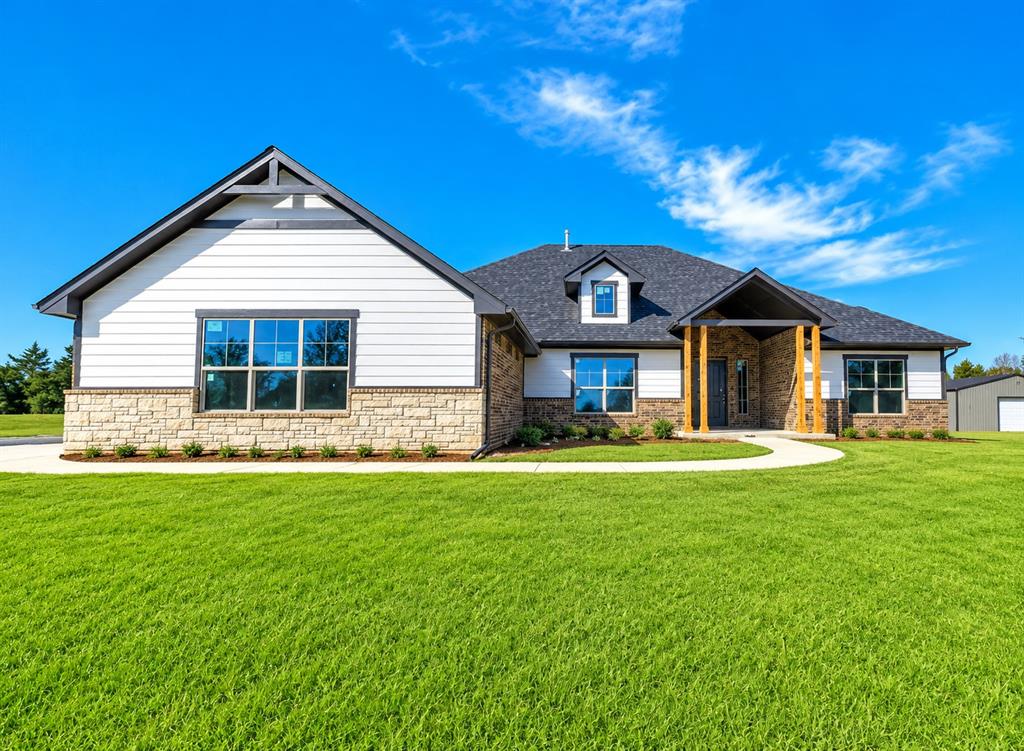 SELLER IS OFFERING $10,000 CONCESSIONS, USE IT TOWARDS CLOSING COST, UPGRADES, OR FOR A RATE BUY DOWN. For added peace of mind, this home includes the standard builder’s warranty plus an additional 10-year Limited Structural third party Warranty through RWC, offering long-term confidence in your investment! SPECIAL OFFER, 1% BONUS PROVIDED BY PARTICIPATING LENDER TO BE USED TOWARDS CLOSING COST OR INTEREST RATE BUY DOWN. Welcome to Whispering Winds – Edmond’s Newest Hidden Gem! This brand-new 4-bedroom, 3-bath home sits on a spacious .75-acre lot and offers 2,547 sq ft of thoughtfully designed living space. A 30x40 shop with a concrete pad, overhead door, walk-through door, and moisture barrier insulation is included – perfect for hobbies, storage, or workspace needs! Inside, you’ll find a flexible floorplan that includes a Media/Rec Room, ideal for movie nights, game days, or a home office. The cozy wood-burning fireplace, hand-textured walls and ceilings, and elegant ceramic tile and quality carpet create an inviting, high-end feel throughout. The chef-inspired kitchen features granite countertops, stainless steel appliances, and plenty of room to entertain. Whether you're hosting or relaxing, this home offers a perfect balance of comfort, functionality, and style. Located in the peaceful Whispering Winds Community, you'll enjoy the tranquility of open space with the warmth of neighborhood living. Schedule your private showing today! Chickens are allowed.