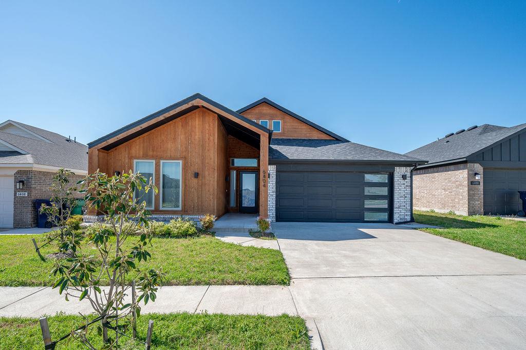 Welcome to 6404 SE 87th Street in the desirable Abbot Lake community of southeast Oklahoma City. This beautifully maintained Craftsman-style home offers modern comfort, open living spaces, and elegant finishes throughout. Step inside to find a spacious layout filled with natural light, featuring high ceilings and durable wood-look flooring that flows seamlessly through the main living areas. The open-concept kitchen is thoughtfully designed with abundant cabinetry, stylish countertops, and a large island that connects to the dining and living areas, creating a perfect space for entertaining or family gatherings.

A dedicated study or flexible space provides an ideal spot for remote work or quiet reading. The primary suite offers a peaceful retreat with a private bath featuring dual sinks, a soaking tub, and a separate shower. Secondary bedrooms are generously sized with ample closet space and a shared full bath.

Outside, enjoy the covered patio overlooking a fenced backyard—perfect for relaxing evenings or weekend barbecues. The home’s exterior design blends timeless appeal with easy maintenance, and the neighborhood includes walking trails, a scenic pond, and planned community amenities such as a splash pad and fishing dock.

Located in the Moore School District, this home offers quick access to major highways, shopping, and dining while maintaining a quiet suburban atmosphere. With a low annual HOA fee covering common area maintenance, this home combines quality, convenience, and lifestyle in one inviting package. Schedule your private tour today and experience what makes Abbot Lake one of southeast Oklahoma City’s most welcoming communities.