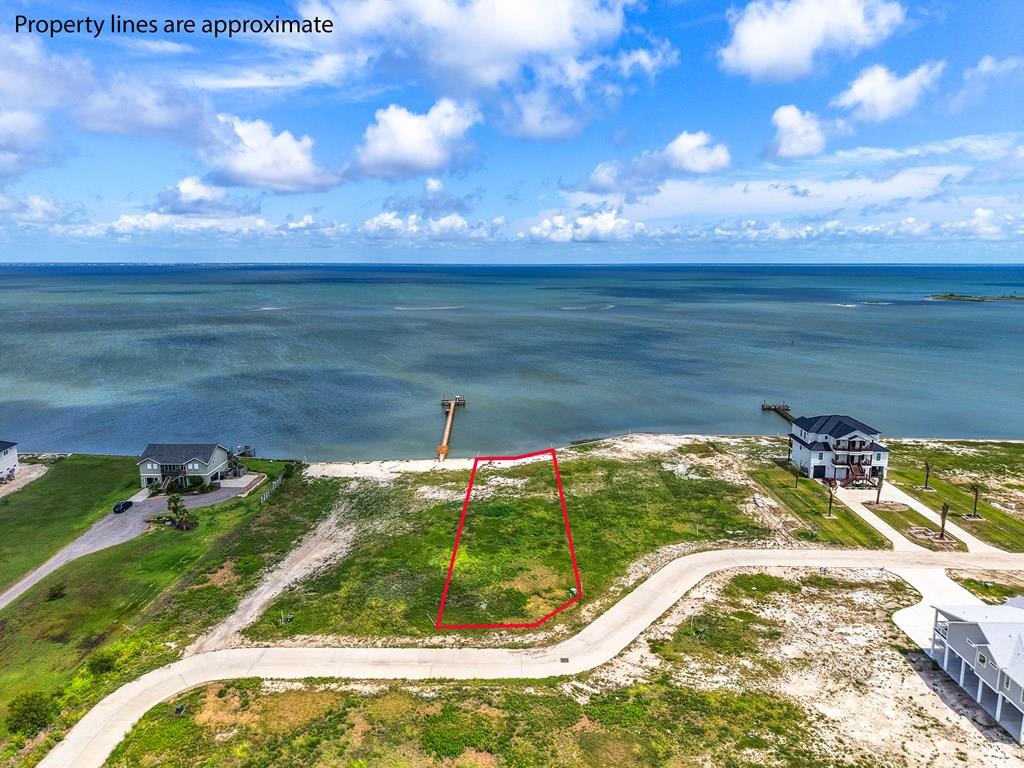 Build your coastal dream home on this exceptional bayfront lot at 6 Tradewinds Circle in the highly desirable Southwind Harbor subdivision of Cape Velero.  Offering just over 1/2 acre with approximately 80' of waterfront, this prime homesite is already bulkheaded and ready for your vision to come to life.  Enjoy breathtaking bay views, coastal breezes, and the perfect setting for a waterfront retreat designed around the laid-back Rockport lifestyle.  Southwind Harbor offers a community boat ramp for easy access to some of the best fishing on the Texas Coast.  Spend your days chasing trophy Redfish, speckled trout, flounder, and black drum in Copano Bay, Estes Flats, San Antonio Bay and the surrounding back lakes.  Waterfowl hunting, kayaking, birding, and endless outdoor adventures are right at your doorstep.  Located just minutes from downtown Rockport, you'll enjoy charming coastal shops, local art galleries, waterfront restaurants, live music, festivals, and the relaxed small-town atmosphere that makes the Texas coast so special.  Whether you're looking for a weekend getaway or a full-time waterfront lifestyle, this property offers the perfect opportunity to experience everything the Rockport-Fulton area has to offer.