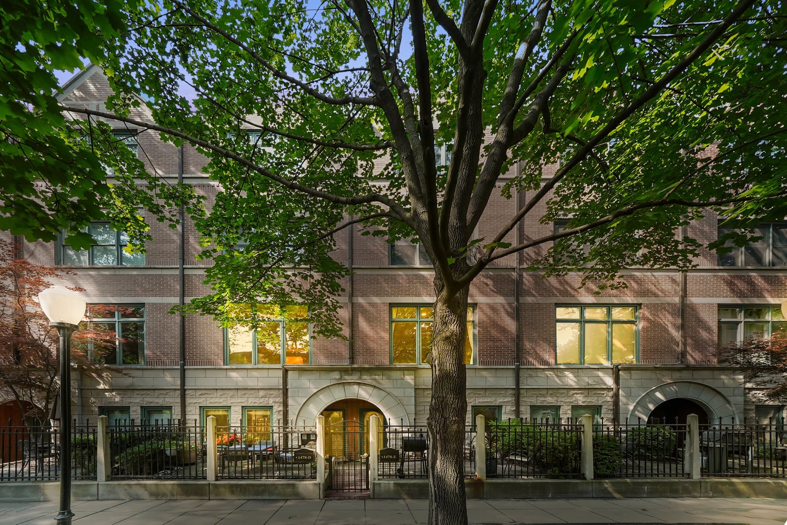 Welcome home to this 3 bedroom, 2 and a half-bath Park Row Townhome located in Chicago's coveted Central Station. Nestled on a quiet, tree-lined drive with gated entrance and private front patio, this elegant residence offers a rare combination of privacy, thoughtful design, and sophisticated updates-perfectly positioned just moments from the lakefront, Museum Campus, Soldier Field and all the city has to offer. This spacious, multi-level home has been meticulously updated, featuring a recently renovated designer kitchen outfitted with ALL-NEW Stainless Steel appliances, Sub-Zero refrigerator, contemporary bistro-style dining table, heated floors, granite countertops and beautifully refinished maple cabinetry. The expansive living and formal dining room are bathed in natural light from NEWLY INSTALLED southern-facing WINDOWS and anchored by a sleek fireplace, creating a perfect setting for entertaining. The flexible ground-floor layout includes a bright den or office, ideal for remote work or a quiet retreat. Refinished hardwood floors flow throughout the home, including brand new hardwood on the staircase and upper-level bedrooms. The oversized primary suite is a true sanctuary, boasting vaulted ceilings, a second fireplace, and an abundance of custom-built storage. A one-of-a-kind  library and office nook adds character and charm to this already exceptional space. Two generously sized bedrooms and a fully updated bathroom with granite countertops, new sinks, and refinished cabinetry complete the third level.  Additional features include a lovely patio terrace, full-size, front-facing laundry room, a 1.5-car attached garage and RECENTLY UPGRADED HOT WATER HEATER, FURNACES, and AIR CONDITIONER. The home has been freshly painted throughout and includes a newer roof (2015) with a 30-year warranty. Surrounded by lush landscaping, with access to a beautifully maintained courtyard, this townhome offers the tranquility of suburban living with the energy and convenience of one of Chicago's most dynamic neighborhoods.
