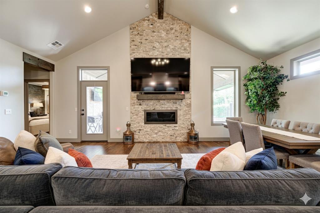 Stop your search. This is the one. Offering 3 bedrooms, 2 bathrooms, and a dedicated office across 2,043 sq. ft., this residence is the perfect blend of luxury and function. From the moment you step inside this custom-built Birnam Woods home, you'll see it redefines "move-in ready." Soaring vaulted and beamed ceilings create an immediate sense of space, while gleaming hardwood floors flow seamlessly through the open layout.

The gourmet kitchen is a chef's fantasy, centered around a massive granite island with a breakfast bar. It’s equipped with high-end appliances and a walk-in pantry so large you'll feel like a culinary celebrity. The main living room, anchored by a sleek gas fireplace, feels both grand and inviting.

Need to work from home? The elegant private office, featuring built-in shelving and a stylish sliding barn door, is your quiet sanctuary. The primary suite is a true retreat, boasting a spa-like bath with a frameless glass shower and a custom walk-in closet.

But the real showstopper is the incredible outdoor living room. This stunning, vaulted covered patio features a gorgeous stacked stone, wood-burning fireplace, making it the perfect spot for year-round entertaining. Don't just buy a home; buy a lifestyle.