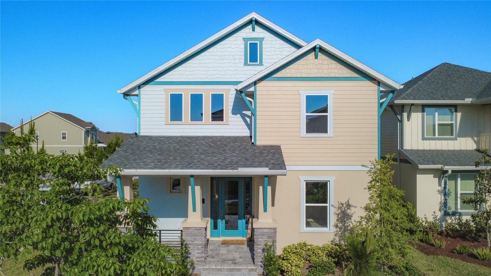 Welcome to this custom, never-lived-in residence in the heart of Laureate Park, gracefully positioned on a premium corner lot overlooking a beautifully landscaped mew and walking path. Built in 2025, this home showcases refined coastal architecture, highlighted by stately stone columns and a charming covered front porch that create a warm yet elevated sense of arrival. Inside, a sense of effortless elegance unfolds. Wide-plank luxury vinyl flooring, expansive windows, and a thoughtfully designed open-concept layout create a light-filled and inviting atmosphere. The kitchen is both refined and functional, featuring stone countertops, under-cabinet lighting, built-in stainless steel appliances, a designer vent hood, and a walk-in pantry—all seamlessly flowing into the dining and living areas, offering the ideal setting for both everyday living and effortless entertaining.The main level is designed with flexibility and comfort in mind, offering two well appointed guest bedrooms connected by a Jack & Jill bath, a private office with French doors, and generous storage spaces and a convenient laundry room. Upstairs, a generous and versatile loft provides  the perfect backdrop for a secondary living space, media room, or play area, adapting easily to your lifestyle.The primary suite serves as a serene retreat, offering peaceful views, a spacious walk-in closet, and a spa-inspired bath complete with dual vanities and a glass-enclosed shower. Two additional bedrooms and a full bath complete the second floor, providing comfort and privacy for family and guests alike.Step outside to enjoy the covered rear patio, leading to a detached 2.5-car garage with additional storage, a paver walkway, and low-maintenance landscaping designed for easy living.Beyond the home, Laureate Park offers an unmatched vibe and lifestyle. Residents enjoy access to the Aquatic Center, resort-style pools, LP Fit fitness center, and over 44 miles of scenic trails. Ideally located in Lake Nona’s Medical City, you’re just minutes from the VA Hospital, Nemours, top dining, shopping, and entertainment, with convenient access to major highways, Orlando International Airport, the USTA National Campus, and Central Florida’s world-renowned attractions and beaches.This residence presents a seamless blend of modern luxury, thoughtful design, comfort, and an exceptional community setting—an all in one opportunity in one of Orlando’s most sought-after neighborhoods.Schedule your private showing and experience elevated living firsthand