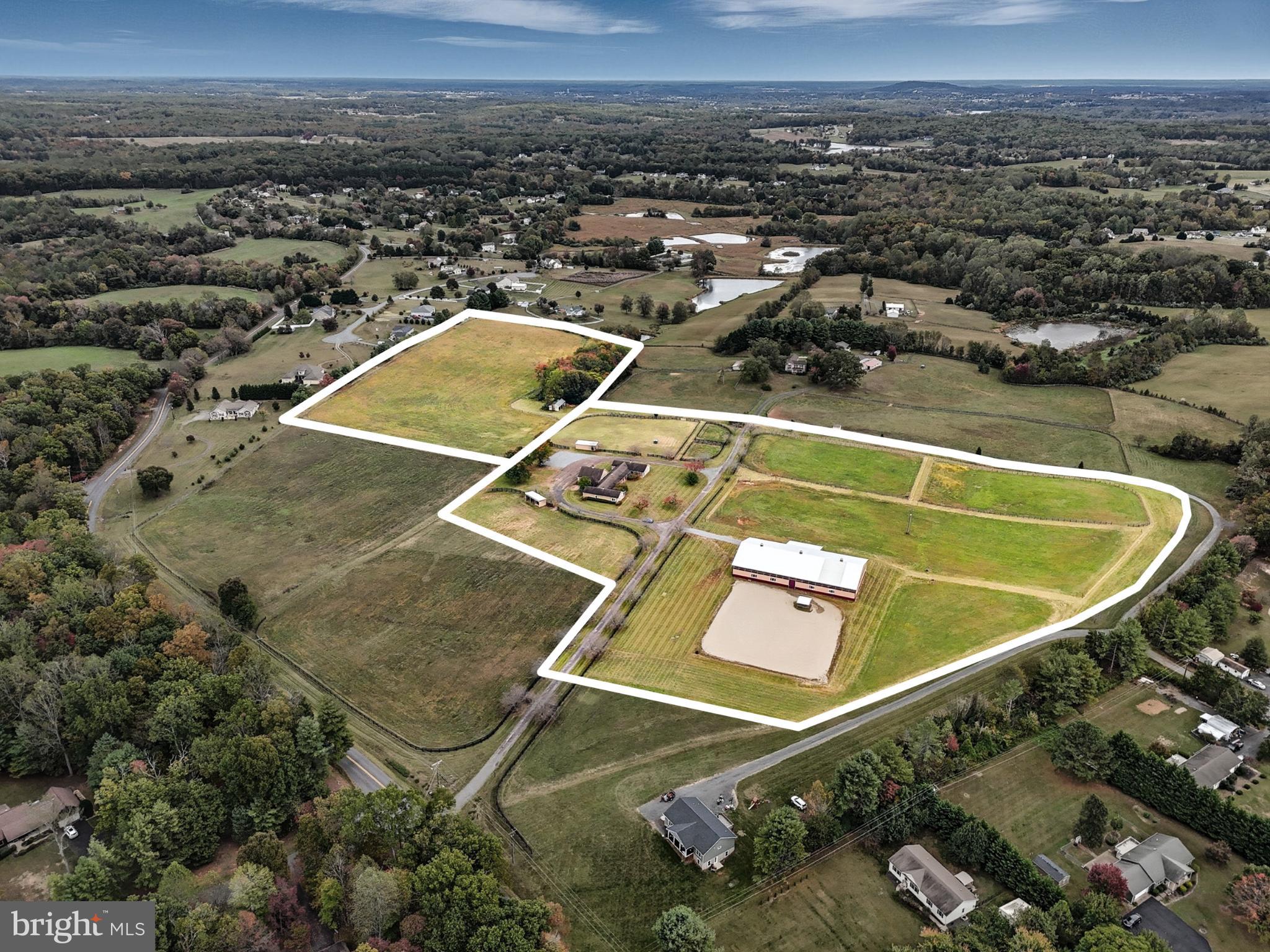 Opportunity Awaits! Ideal turnkey equine-oriented property for an active boarding and/or training facility on 24+ acres.  Enter down a gorgeous cherry tree lined driveway to the barns and indoor/outdoor arenas. The stable side contains 14 fully matted stalls across two barns - 8 in the main barn and 6 in the addition. Complete with two wash stalls with hot/cold water, two large tack/feed rooms (one of which is heated), hay loft, half bath and a 1-2 Bed/1 Bath apartment.  The indoor arena offers 160x80 sq/ft of well-lit space and an adjoining 24x36 annex with two offices/bedrooms, one full bath, large common/lounge area, utility/laundry, kitchenette and oversized plexiglass windows allowing for comfortable viewing.  The indoor area opens directly onto a 150x150 outdoor arena, complete with covered gazebo. 6 separate fenced paddocks, several with run in sheds and water run to most.  Well thought out driveway system ensures you'll have plenty of room to park and never had to back your trailer up. The stables and the arena both offer 50-Amp RV hookups for visitors, vets, etc.  A short trailer ride to incredible trail systems ... 15 minutes to Culpeper, 20 minutes to HITS and close to several Hunt Clubs. Looking to build your home close by? Your dream home will look fantastic on the additional adjacent 10-acre estate lot, now included in this sale. Don't miss your opportunity.