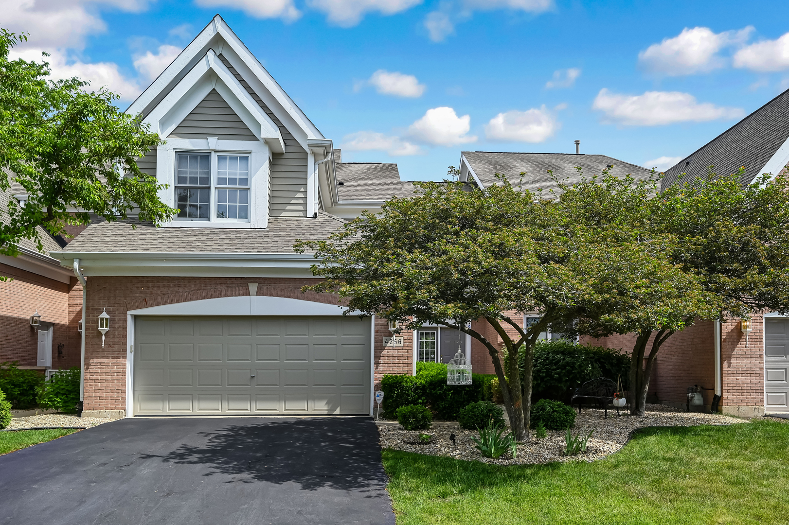 Welcome to White Eagle's highly sought-after Stableford Townes community! This beautifully maintained 2-story townhome offers over 2,000 square feet of living space plus a fully finished basement, combining comfort, functionality, and an unbeatable location. Backing directly to open green space and the neighborhood Kingshill Park, this rare offering provides exceptional privacy and scenic views rarely available in the community. Step inside to soaring ceilings, abundant natural light, rich refinished hardwood flooring, and an inviting family room with a fireplace. The spacious eat-in kitchen / breakfast nook flows seamlessly to the dining area and large refinished deck, creating the perfect space for entertaining or relaxing outdoors. Upstairs, you'll find a generous primary suite with walk-in shower and an oversized hot tub, a spacious secondary bedroom, and a versatile loft ideal for a home office, reading nook, or flex space which can be converted to a third bedroom. The finished basement adds valuable living space with a recreation area, pantry, walk-in closet, full bath, and extensive storage room. Additional highlights include a main-floor laundry room with shoe cabinet, attached 2-car garage with epoxy flooring, mature landscaping, and access to White Eagle's exceptional amenities including pool, tennis courts, clubhouse, parks, and security patrol. Located within highly acclaimed Indian Prairie School District 204, serving White Eagle Elementary School, Still Middle School, and Waubonsie Valley High School. HOA provides a low-maintenance lifestyle with exterior maintenance, professional landscaping, lawn care, snow removal, common insurance, clubhouse, pool, tennis courts, parks, and White Eagle 24-hour security patrol services. Enjoy convenient access to shopping, dining, golf, parks, and major transportation routes while living in one of Naperville's most desirable communities. A rare opportunity to own a park-view home in Stableford Townes of White Eagle.
