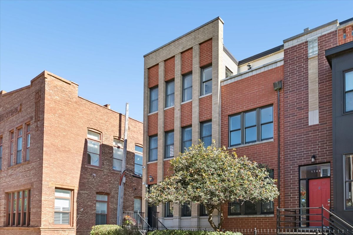 1743 W Terra Cotta Pl is a masterclass in thoughtful urban design and sophisticated Lincoln Park living. This townhome is the perfect single family-alternative offering more natural light than most, seamless transitions, and multiple levels of flexible spaces. Buyers are always saying they want non-cookie cutter homes, here it is!  The main level makes a striking first impression with soaring vaulted ceilings that amplify the sense of space. The open-concept kitchen and dining serve as the heart of the home, with a wall of folding doors that create a fluid indoor-outdoor experience perfect for maximizing your time outdoors.  The unique dedicated primary sanctuary, encompasses the entire top floor for ultimate privacy. This retreat features a versatile bonus room-imagine a sun-drenched morning lounge, a home gym, a quiet office, nursery, or end of the evening wind-down tv lounge. The options are yours to imagine. Step outside onto the south-facing private deck to take in views of the Chicago skyline, a perfect backdrop as the city transitions from day to night.  The townhome's footprint continues on the second level with two bright bedrooms and a full bath, while the lower level offers a spacious secondary living area with street-level windows that pull in natural light. Practicality meets luxury with a gated front yard and an attached garage, offering the kind of effortless convenience that is often rare in city living. Beyond the home, you are positioned in the top-rated Prescott School district (10/10) and just minutes from elite high schools like Lane Tech and Lincoln Park. The neighborhood is peppered with a mix of long-time retailers, local staples, and trendy new dining. With easy access to the highway and public transportation, all of Chicago's most desirable neighborhoods are at your fingertips.