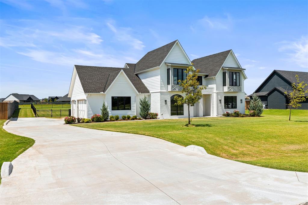 Welcome to this stunning modern home in the highly sought after Brentwood Addition in Norman, just off Hwy 9! Situated on a spacious 0.75-acre lot, this home offers an eye catching front elevation, wrought iron fencing, and a covered back patio perfect for enjoying unforgettable Oklahoma sunsets. From the moment you walk in you're greeted with sweeping views straight through to the expansive backyard. The open-concept layout is ideal for entertaining, featuring a breathtaking kitchen with a massive island, abundant cabinetry, gas appliances, and a walk-in pantry that will exceed your storage needs. The adjoining dining space overlooks the peaceful backyard, creating the perfect backdrop for everyday living and elegant entertaining. The living room is equally impressive, featuring 12-foot ceilings, a stunning floor-to-ceiling fireplace, and an abundance of natural light that fills the space with warmth and charm. The main floor includes 4 bedrooms (or 3 plus an office), 2.5 bathrooms, a mud bench, and a well-appointed laundry room. The first floor luxurious primary suite offers dual vanities, a walk-in shower, a freestanding tub, and a closet that dreams are made of. Upstairs you'll find a spacious versatile bonus room, an additional bedroom, and a full bathroom—perfect for guests, teens, or a private retreat. Pictures were taken before the new white oak floors were installed on the staircase and entire upstairs living areas.  This is the first resale home in the neighborhood and has only been lived in for 2 years, offering the feel of new construction without the wait. Every detail has been thoughtfully designed—this is one you don’t want to miss!