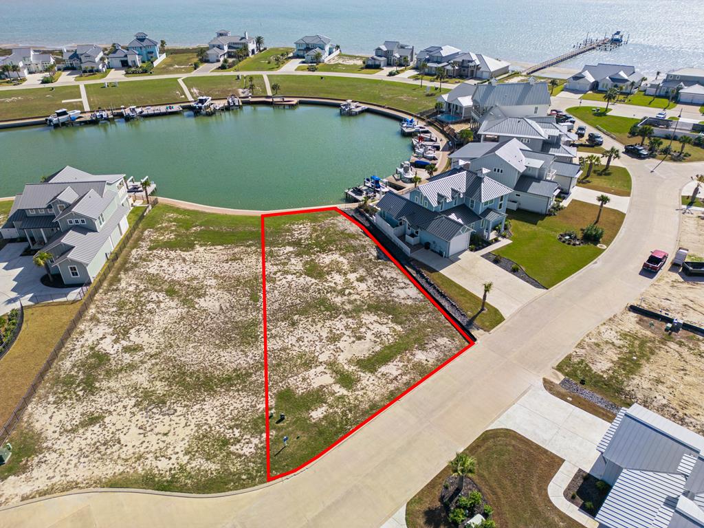One of the few remaining East-facing, canal-front Estate Lots in The Reserve at St. Charles Bay—offering the perfect blend of sunrise views over the water and breathtaking sunsets in the front. This prime homesite is ready for your custom dream home, just steps from the water. Located in a private, gated luxury community, The Reserve provides resort-style amenities, including a lighted boardwalk, private pier, and Bayfront access. Residents enjoy a resort-style pool with cabanas, a hammock park, and beautifully maintained coastal surroundings. Don't miss this rare opportunity to own a premium waterfront lot in one of Rockport's most sought-after communities. Sellers have "Custom House Plans" ready for you to use!