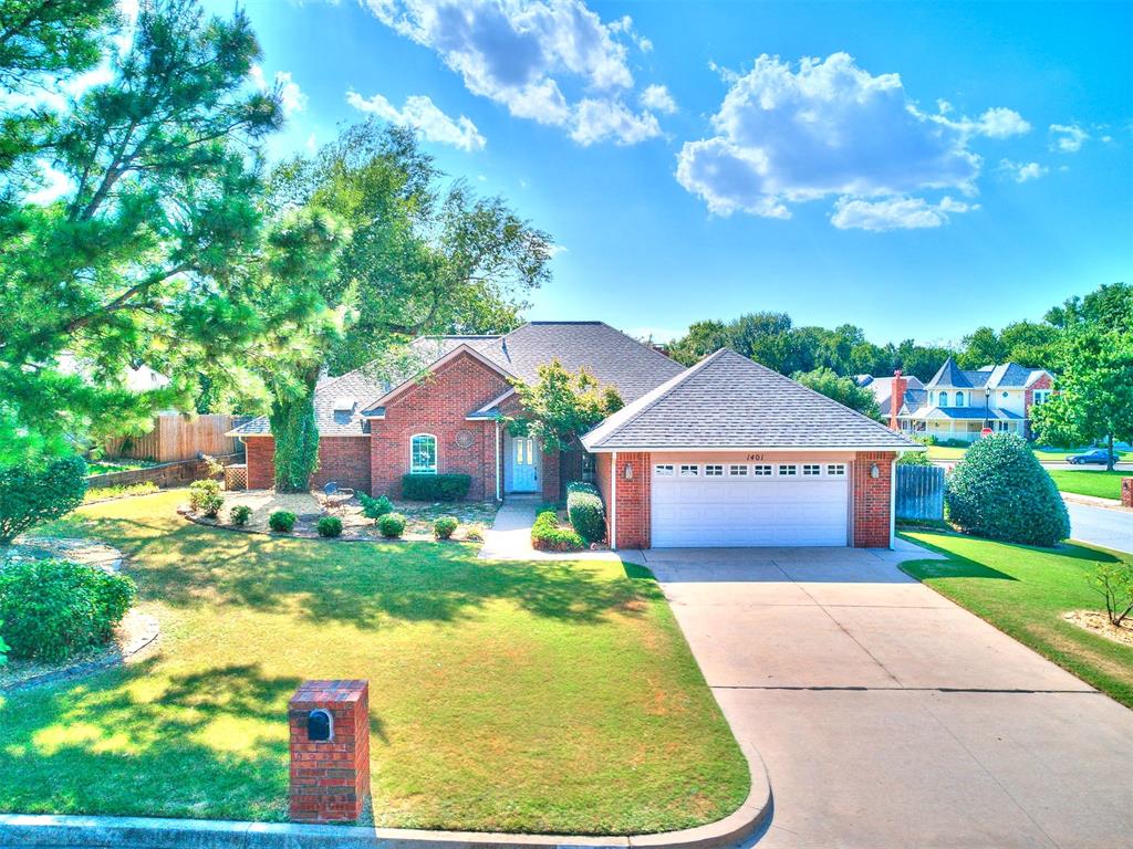 EAST EDMOND | CORNER LOT | LARGE BACKYARD | NEIGHBORHOOD POOLS & TENNIS - - - Charming home with 2 Living Rooms, 2 Dining Rooms and spacious bedrooms! The Kitchen features LUXURY GRANITE COUNTERS, gas cooktop with downdraft vent to exterior, tumbled travertine backsplash, center island, breakfast bar, Double oven/convection microwave, WALK-IN PANTRY and a WINDOW SINK! Other recent upgrades include NEW WINDOWS throughout (except formal living and formal dining), ENGINEERED WOOD FLOORING, New gutters and gutter guards, NEW PATIO COVER WITH SKYLIGHTS! The hearth room off the kitchen features a cozy WOOD BURNING FIREPLACE, and elegant built-ins. The primary suite has wood floors, remodeled shower with designer tile & glass, 2 walk-in closets, and a whirlpool tub. Along with the extended covered patio - you can enjoy scenic yard areas with shade trees, concrete sidewalks around to the garage, and a handy garden shed. Chimney Hill residents enjoy access to fantastic community amenities, including two pools, a playground, basketball and tennis courts, a soccer field, greenbelt areas, and scenic walking trails. Plus, Hafer Park is just a short walk or bike ride away—making outdoor adventures part of your everyday routine! Plus - you can add your own touches with the included $4,000 PAINT/CARPET ALLOWANCE! Come see it today!