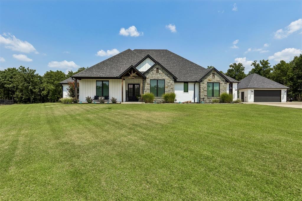 Luxury Living on 1.8 Acres with Unmatched Garage Space!This exceptional 4 bedroom, 3.5 bathroom home offers thoughtful design, premium amenities, & incredible flexibility for everyday living and entertaining. Step inside to an inviting open-concept floor plan where the spacious living room flows seamlessly into the chef's kitchen, creating the perfect gathering space. The kitchen is a dream for any home chef, featuring a gas range, abundant cabinetry, a generous pantry, & plenty of prep space for everything from weeknight dinners to holiday entertaining. Just off the living room, you'll find a versatile room that can serve as a fourth bedroom, private office, playroom, or hobby space, allowing the home to adapt to your lifestyle. The primary suite is a peaceful retreat, complete with dual vanities, an oversized walk-in shower, & two spacious closets.Step outside to an expansive covered patio unlike any other. Featuring clear-view garage doors that fully enclose the space, this outdoor living area can be enjoyed year-round. Relax by the built-in firepit, entertain guests, or simply enjoy the peaceful views of your acreage. Venture farther into the property to a second firepit nestled beneath the trees, creating the perfect spot for evenings under the Oklahoma sky.Car enthusiasts, RV owners, and hobbyists will appreciate the incredible garage setup, offering space for up to seven vehicles: attached 2-car garage, oversized RV garage with a 19.6 ft front door, & 36 ft depth. The detached tandem garage provides space for four additional vehicles, workshop space, or storage & has a rear garage door for easy pull-through access. Additional premium features include: Generac whole-home generator, storm shelter, sprinkler system, VersaLift in main garage, full home water softener, water ozonator in kitchen & oversized driveway w/ ample parking.This one-of-a-kind property offers the perfect combination of luxury, incredible garage space, & peaceful acreage living.