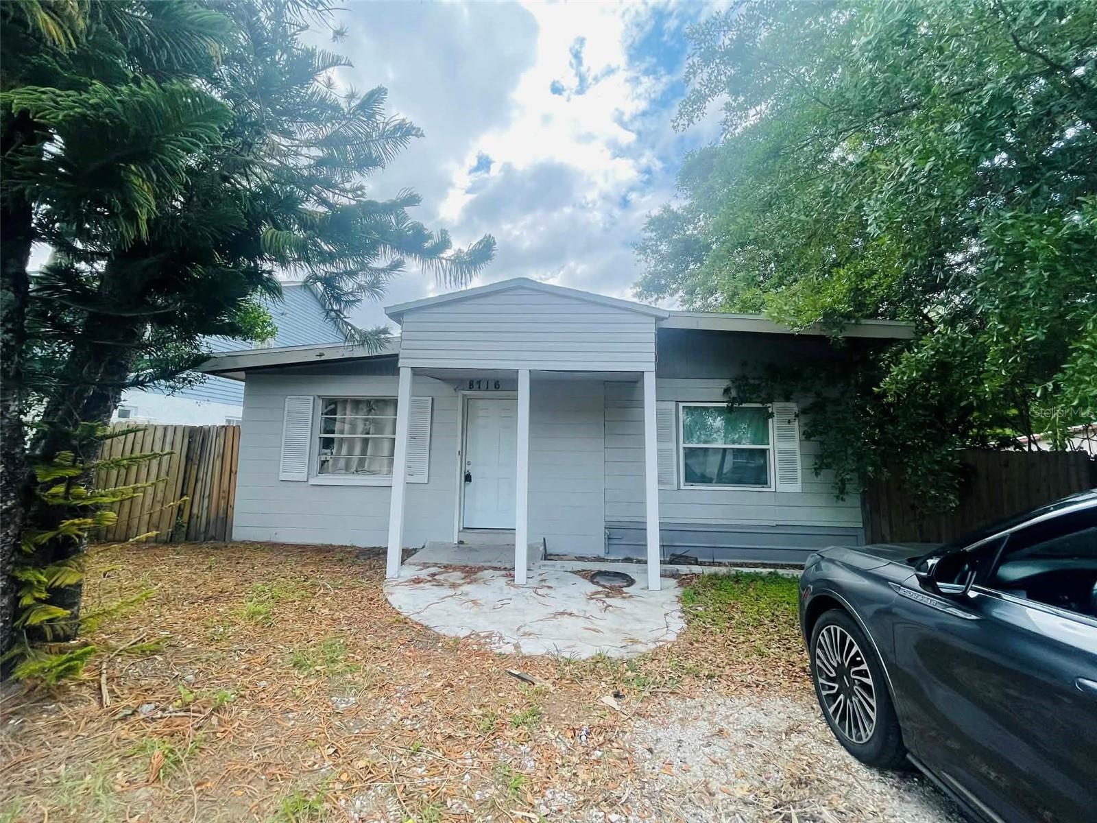 This excellent investment opportunity features a 4-bedroom, 2.5-bathroom home with potential to expand, located in a prime spot with no HOA or CDD fees. This property is set up like a duplex, with one side being 2 bedrooms and 1 bath and the other side being 2 bedrooms and 1.5 baths. You can live on one side and rent out the other to help with the mortgage. The property boasts a newer AC unit installed in 2020, making it an ideal candidate for rental income.  Half home is block and addition is of a modular at some point by prior owner.   While some cosmetic work is still needed, the property's location can't be beat - it's 2 block to Busch Gardens, shopping centers, bus stops, and major highways.